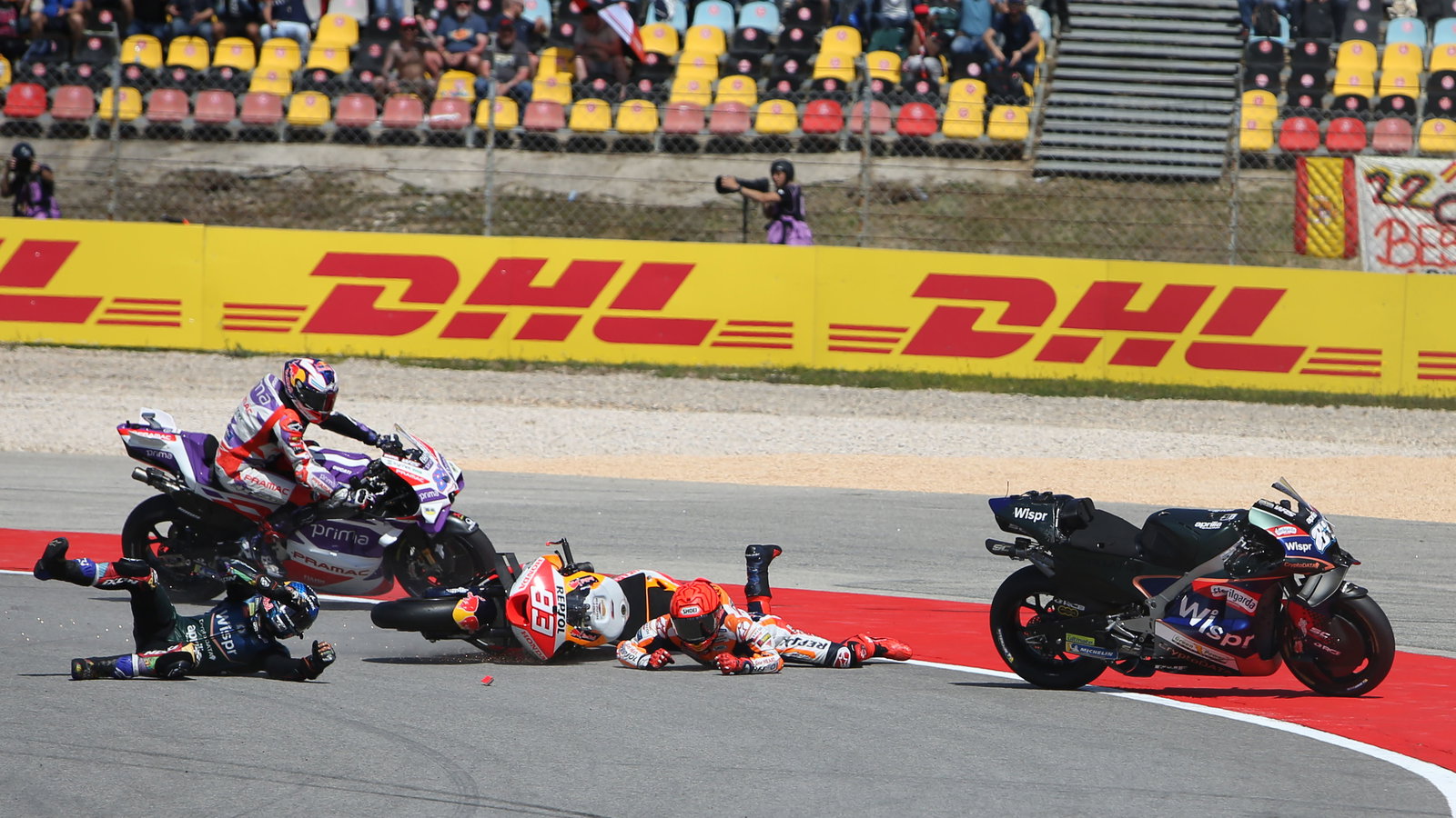 Jorge Martin avoids crashed Miguel Oliveira, Marc Marquez, in 2023 MotoGP Portuguese Grand Prix. - Gold and Goose