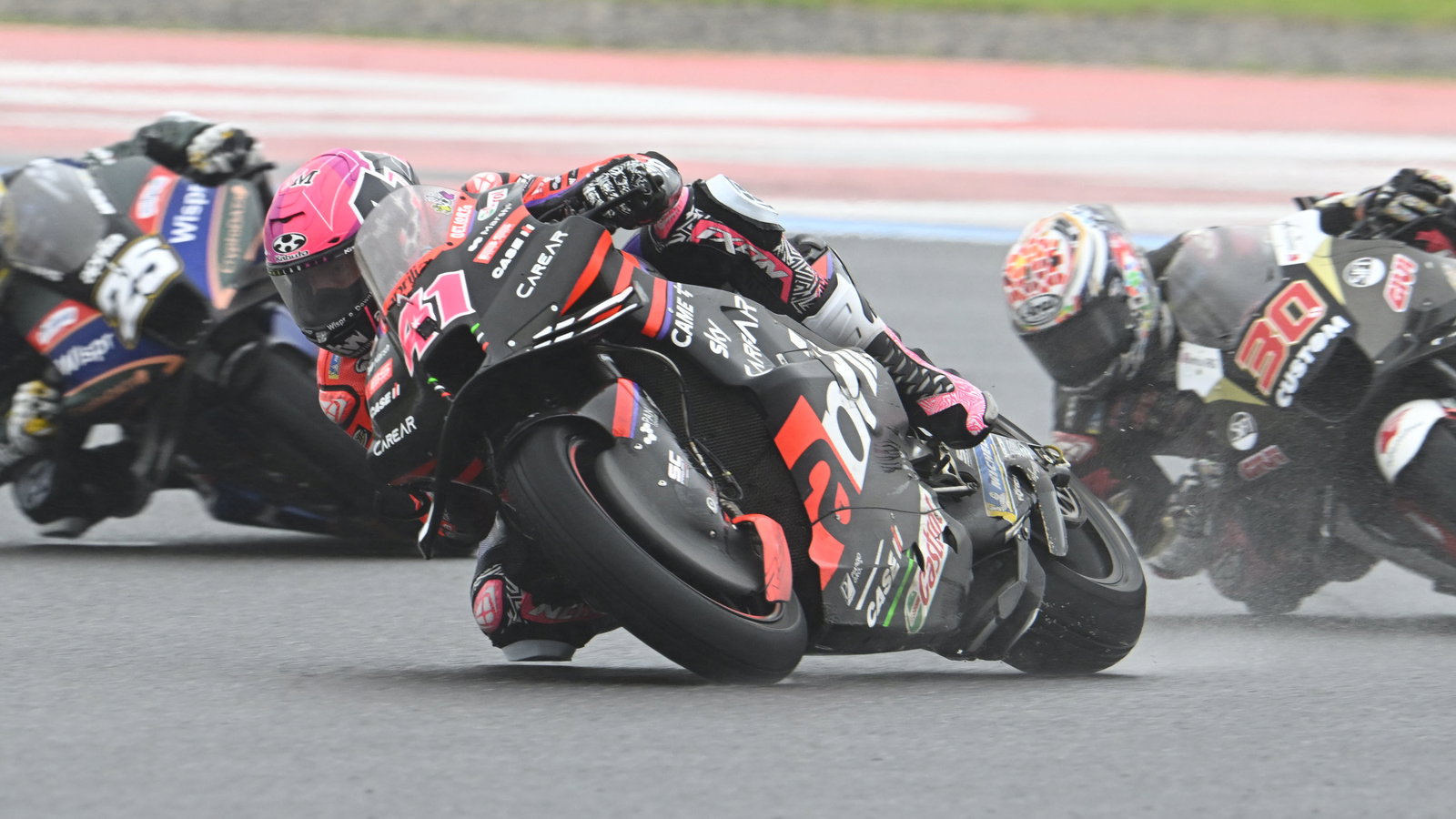 Aleix Espargaro leads Takaaki Nakagami, Raul Fernandez, 2023 MotoGP Argentinian Grand Prix. - Gold and Goose
