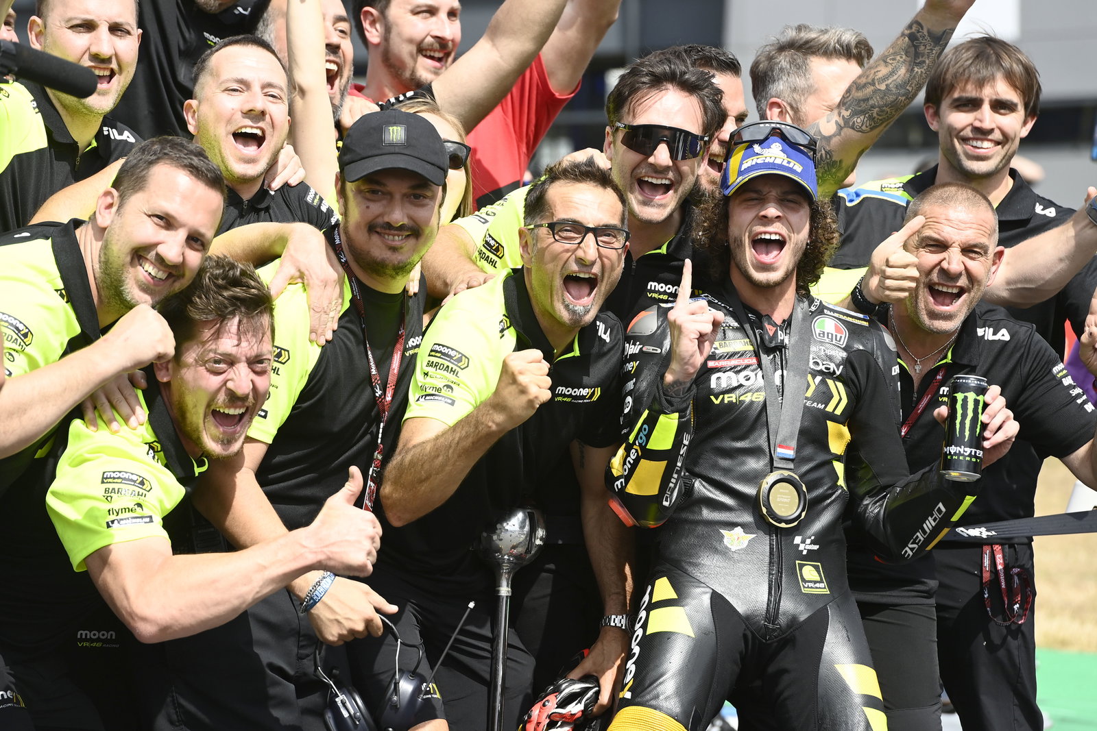 Marco Bezzecchi & VR46 team celebrate 2023 MotoGP Dutch Sprint win. - Gold and Goose