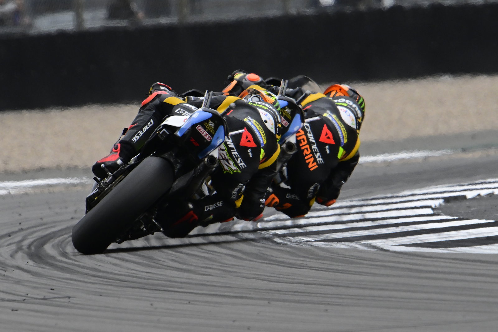 Luca Marini leads Marco Bezzecchi, 2023 MotoGP British Grand Prix. - Gold and Goose