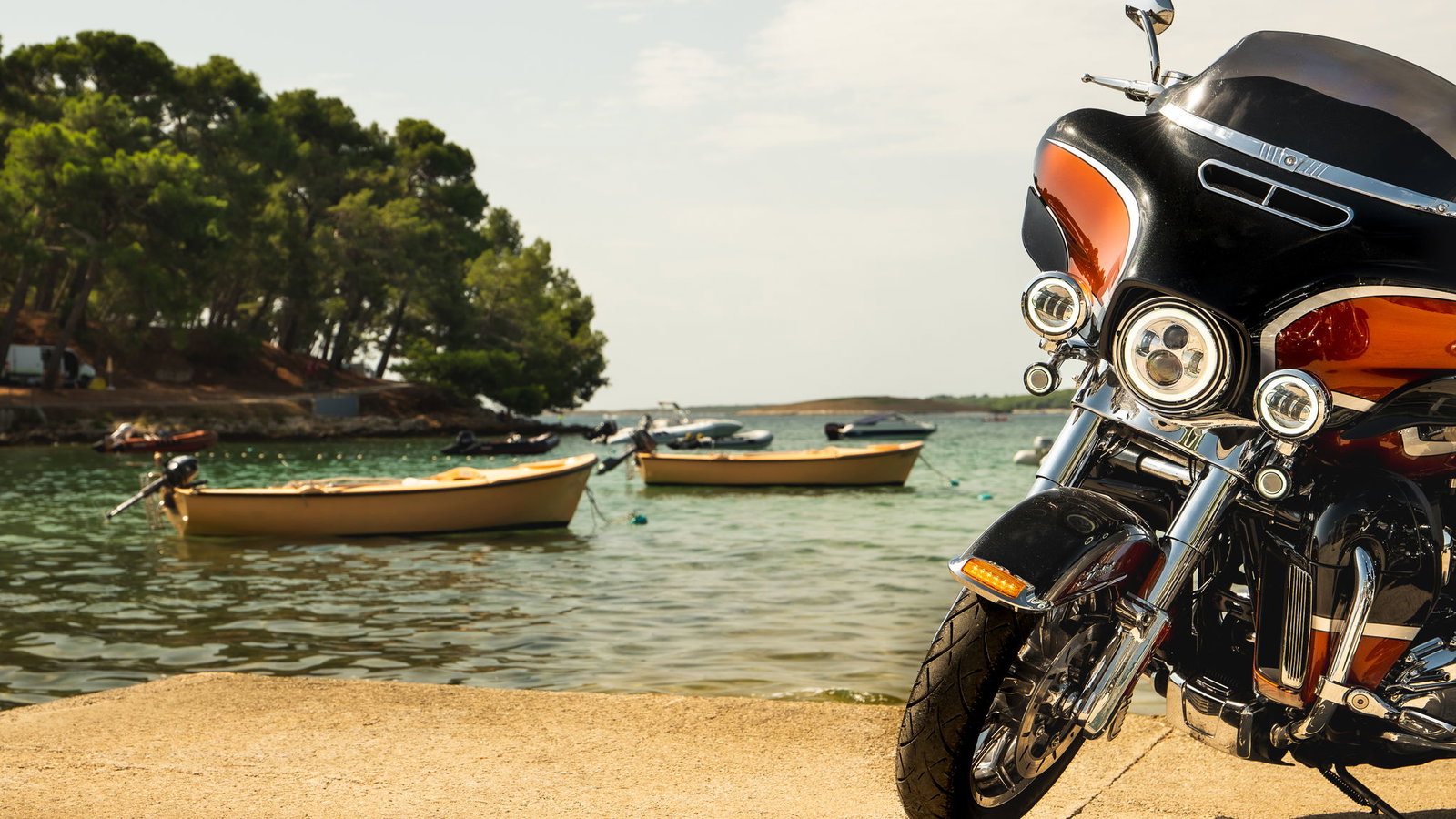 A Harley-Davidson parked next to the sea