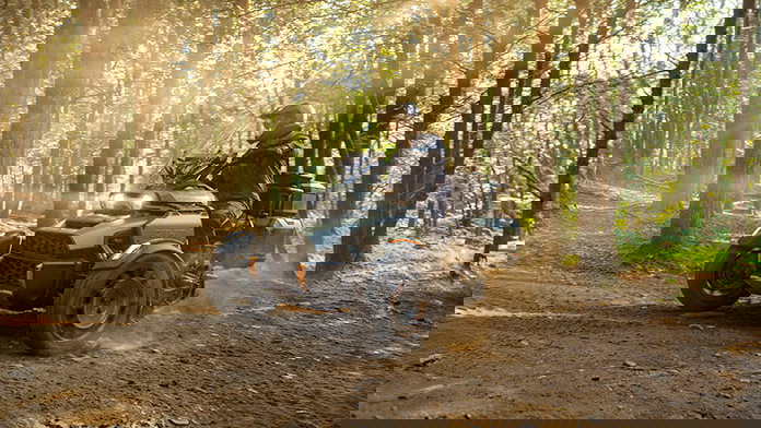 The Can-Am Canyon being ridden in a forest