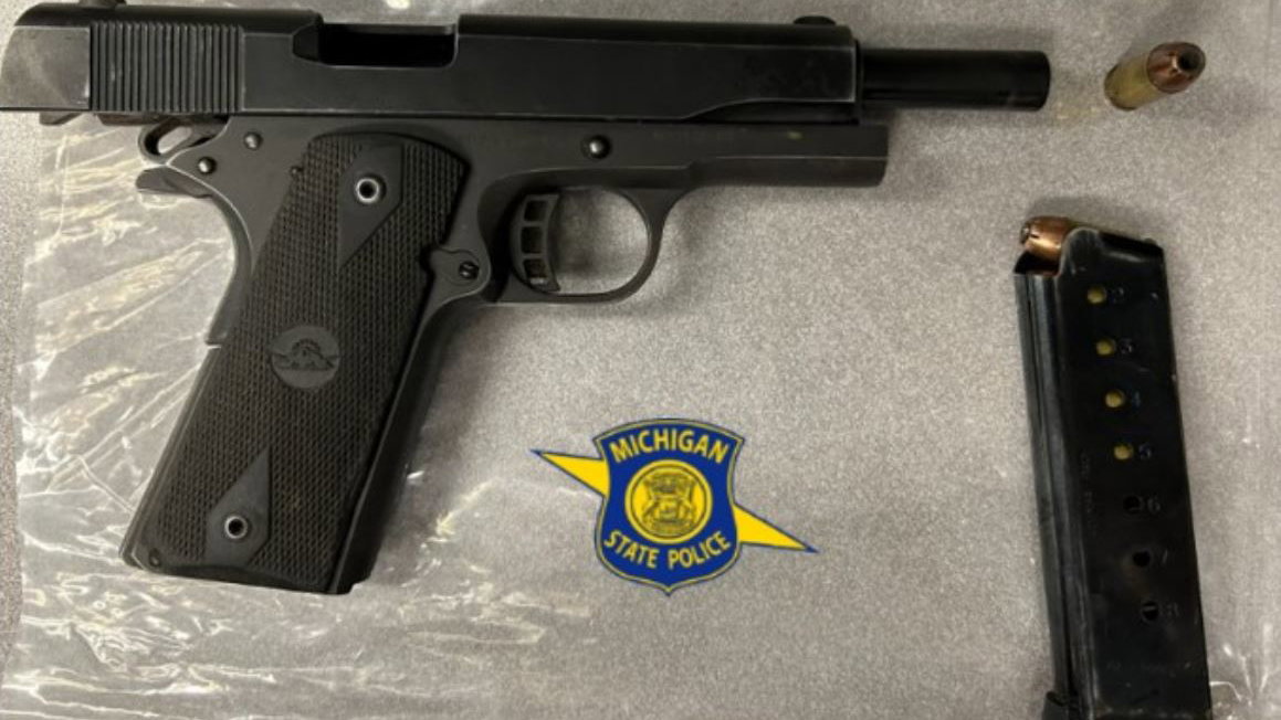 Motorcycle rider caught with gun