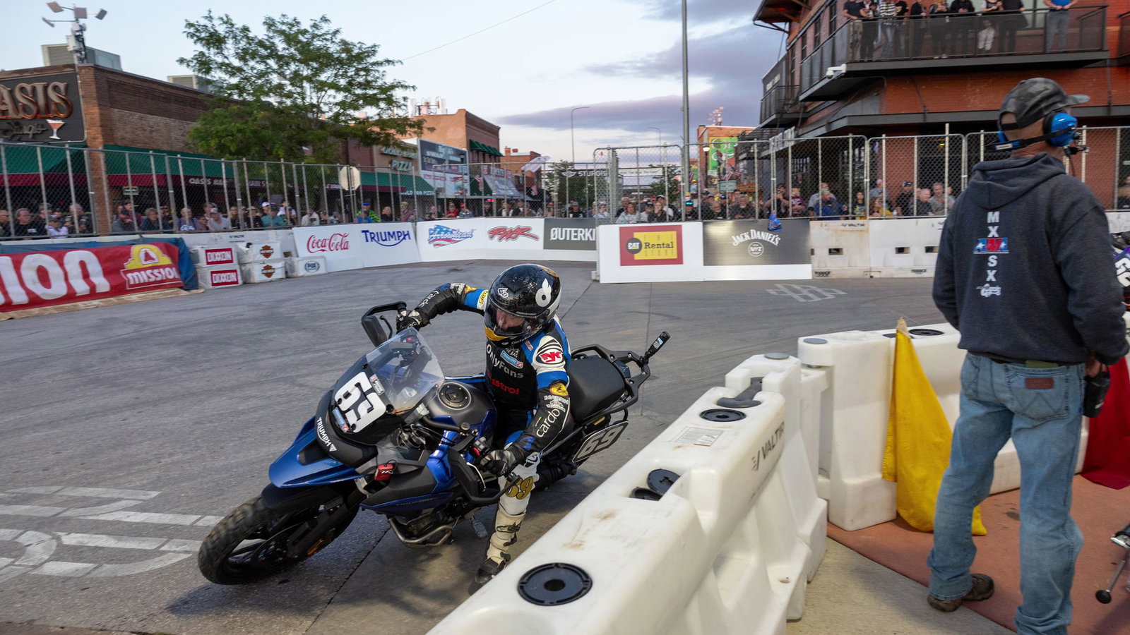 A Triumph Tiger 1200 racing on the streets