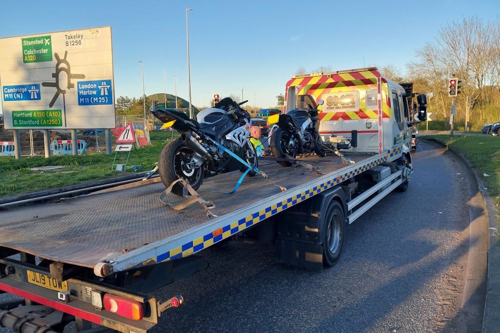 A BMW S1000 RR and Aprilia RSV4 on a police transporter