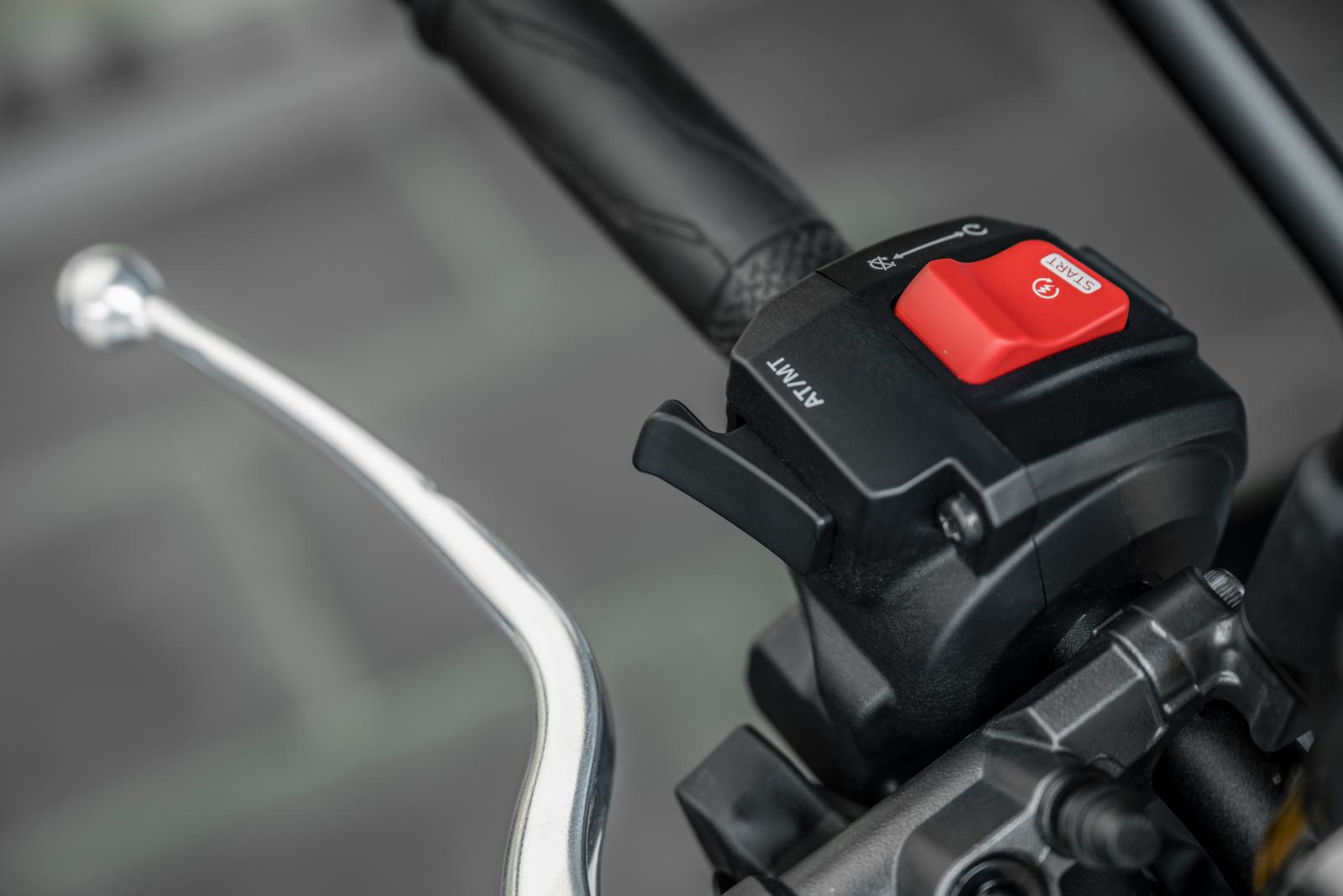 Changing from fully automatic or manual shifting (via paddles) is done on the handlebar