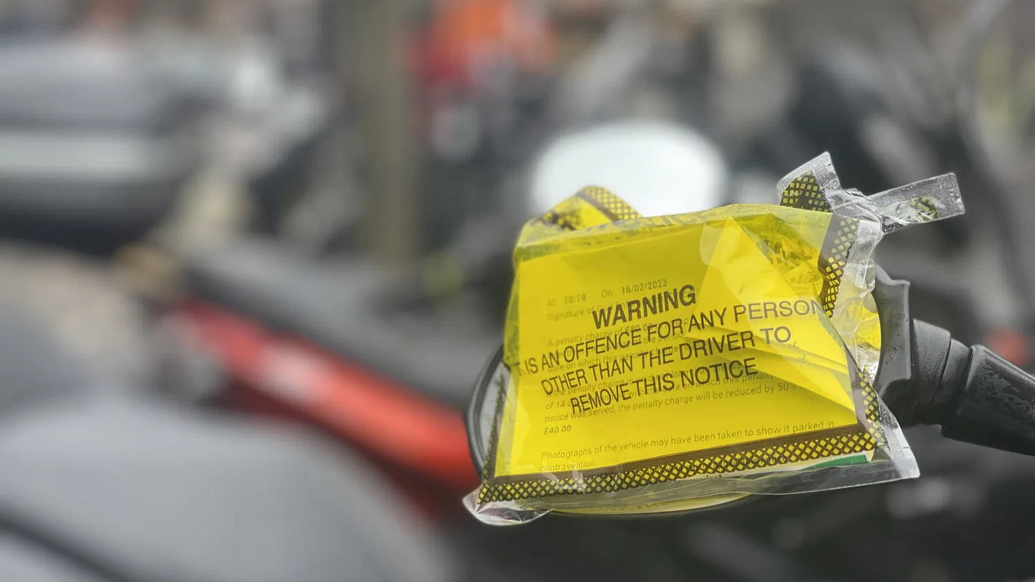 A parking ticket on a motorcycle