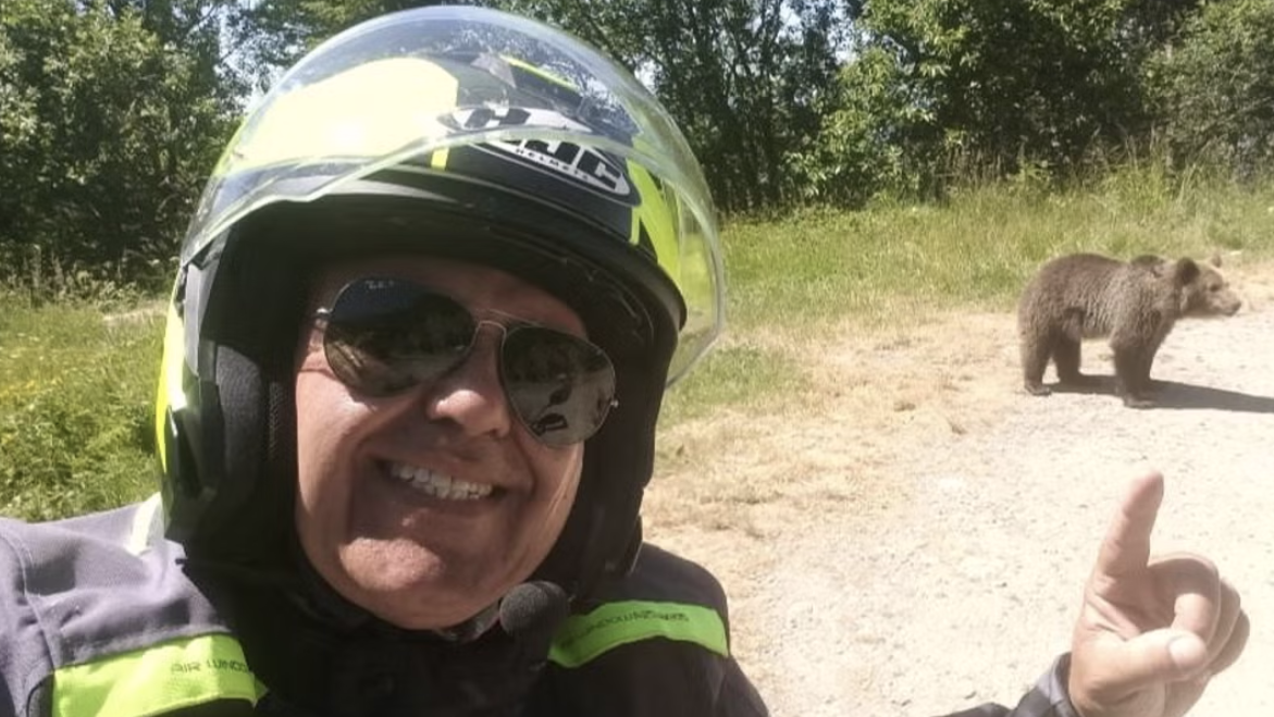 Motorcyclist and bear