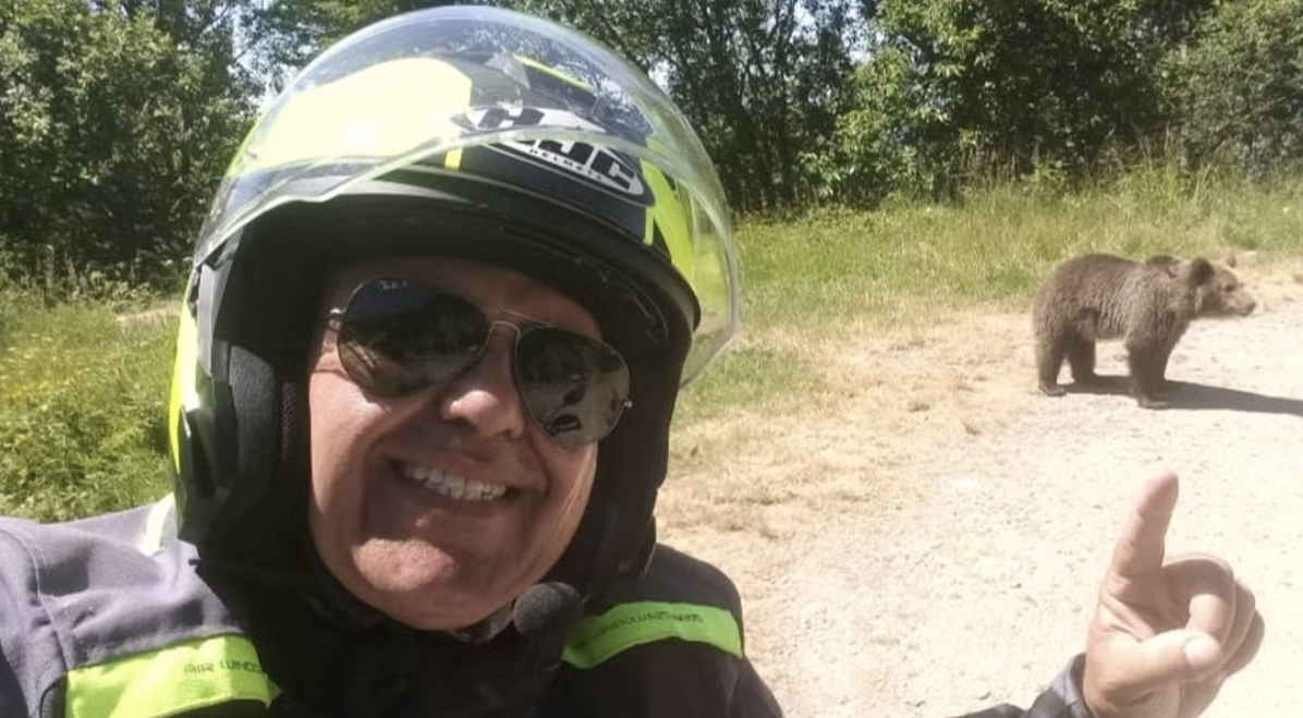 Motorcyclist and bear