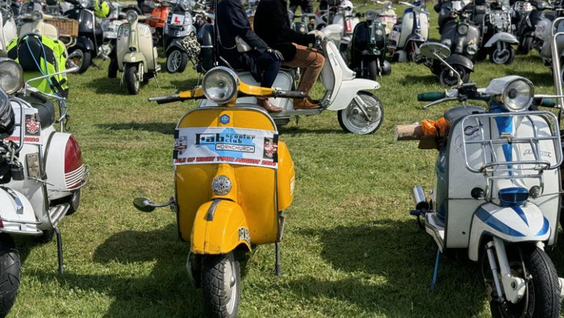 Scooters parked at a rally event. Photo credit - British Scooter Rallies Association