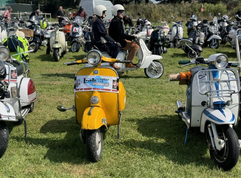 Scooters parked at a rally event. Photo credit - British Scooter Rallies Association