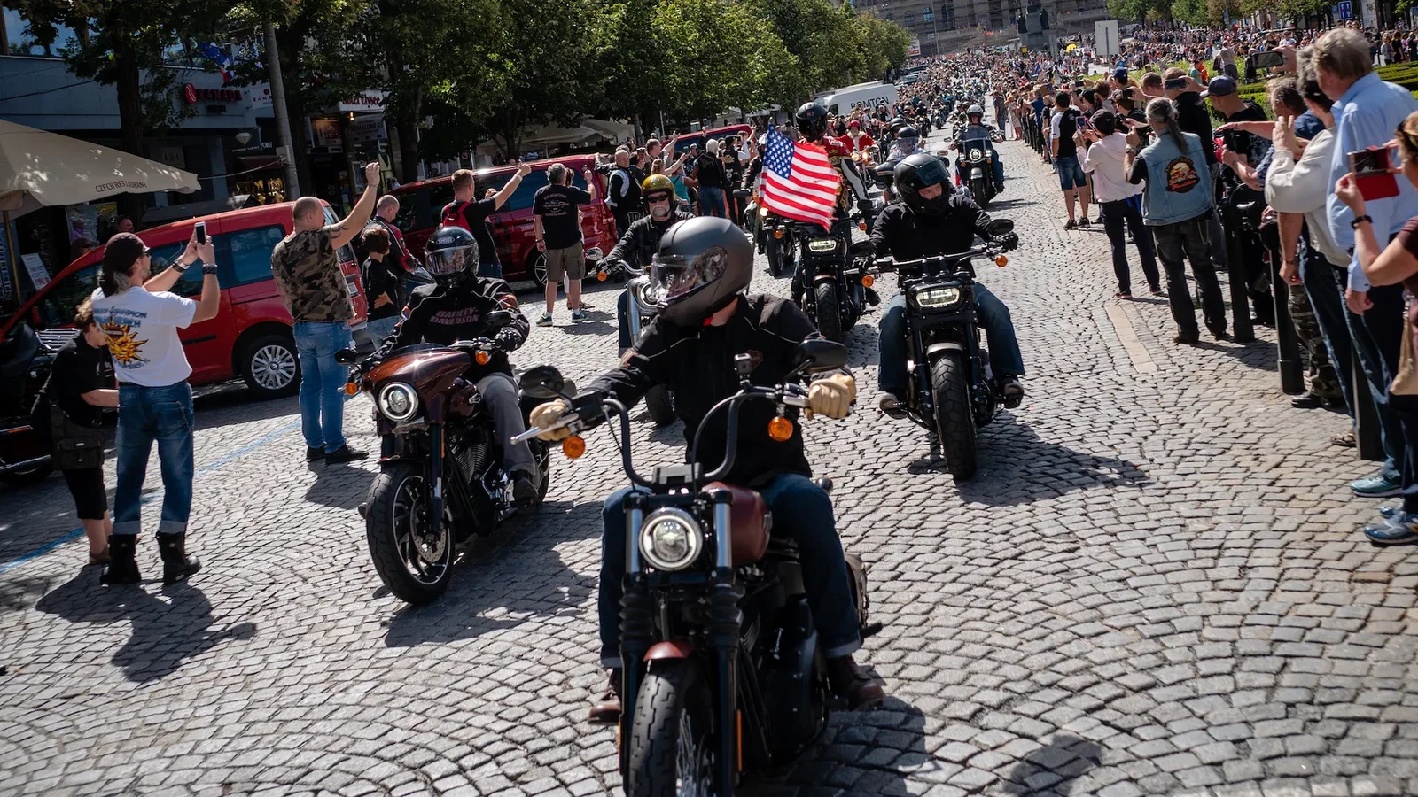 Riding a Street Bob in a parade through Prague in 2018