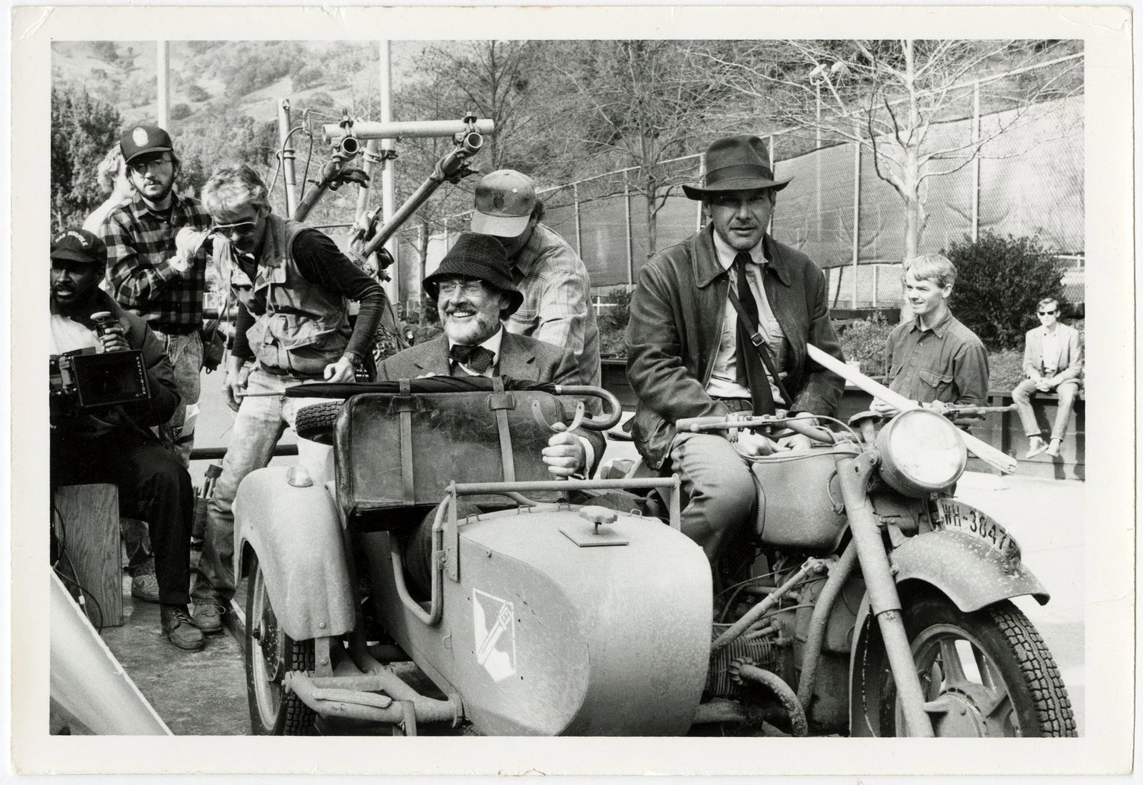 Harrison Ford and Sean Connery riding in the sidecar