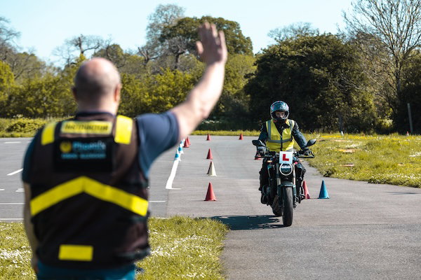Motorcycle learner and instructor carrying out a drill