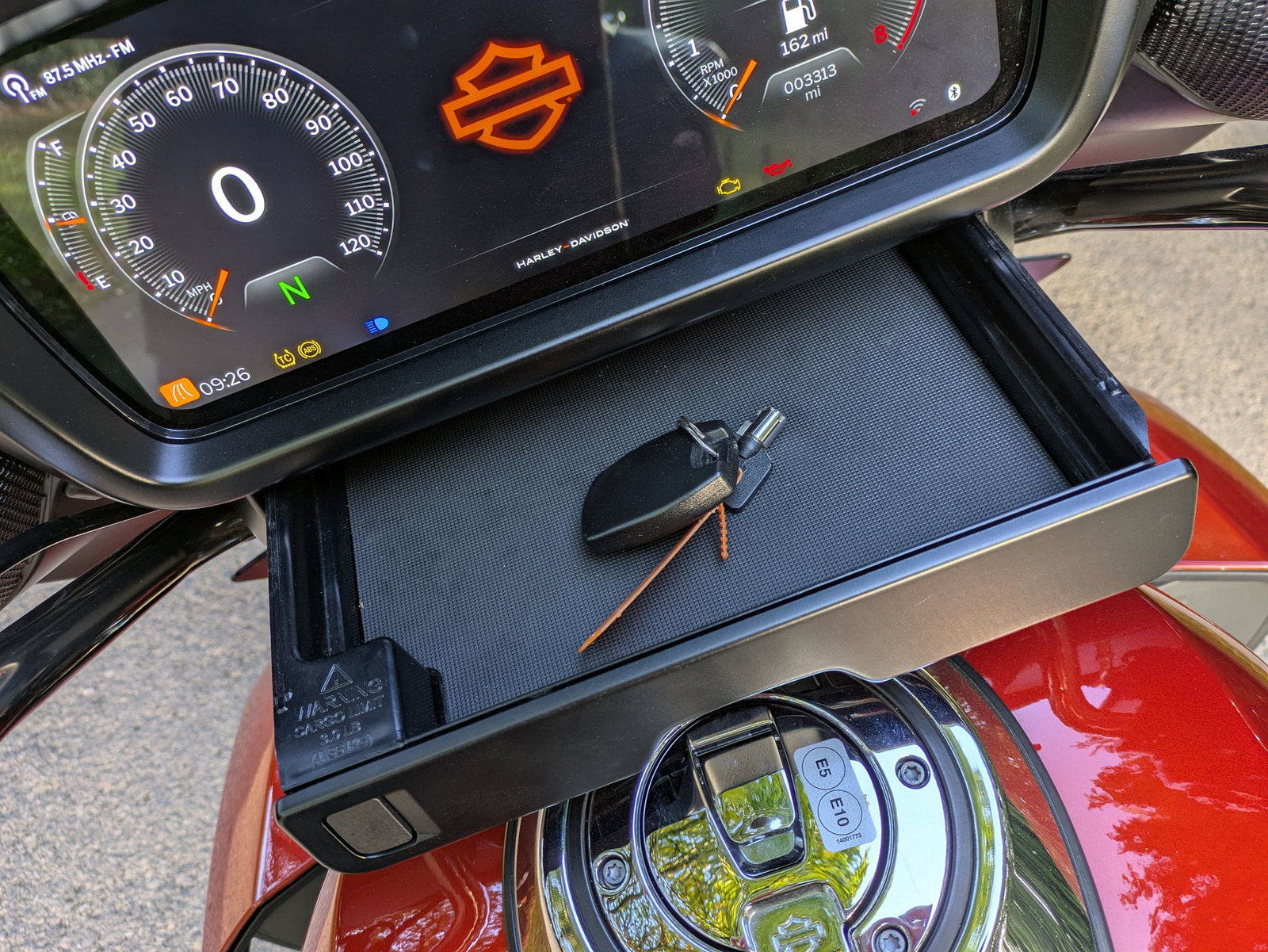 A drawer holds your phone (or the key fob)