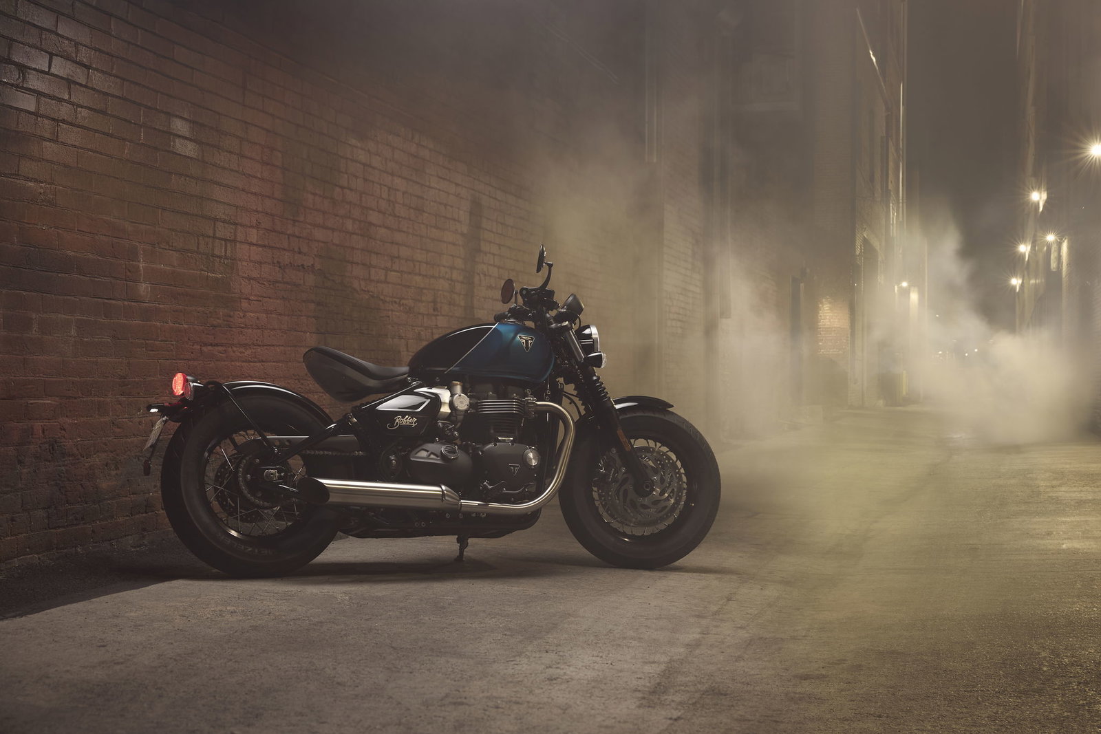 Triumph Bonneville Bobber parked down an alleyway
