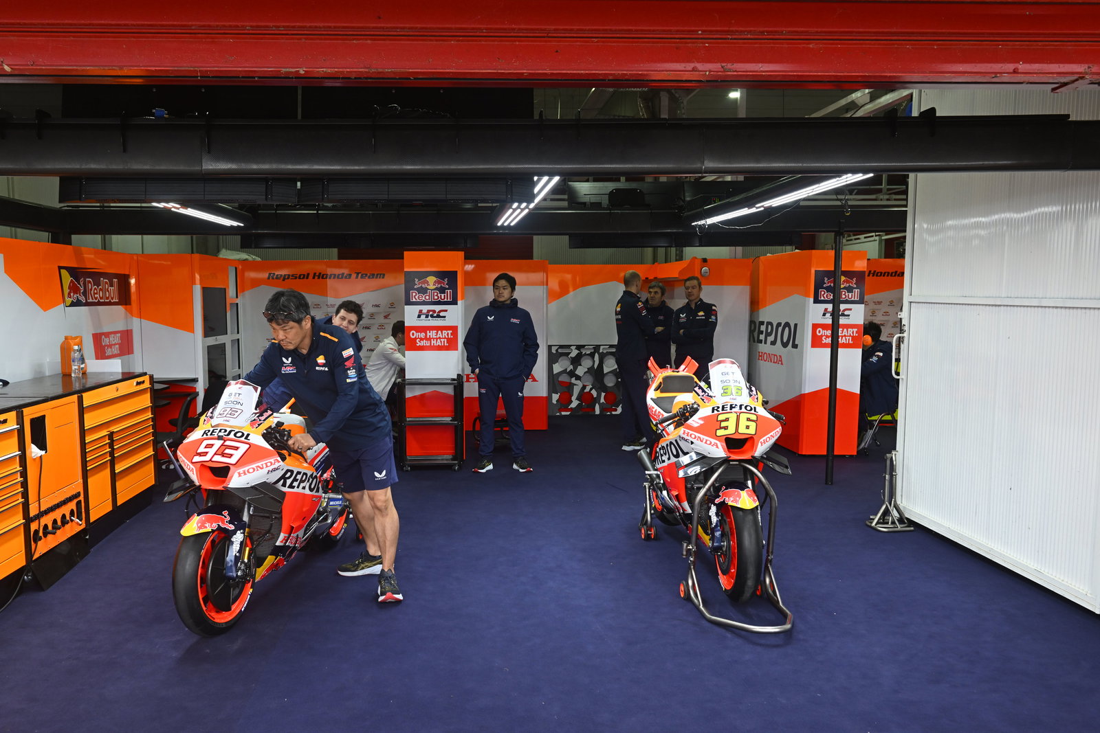 Two Honda MotoGP bikes in their garage