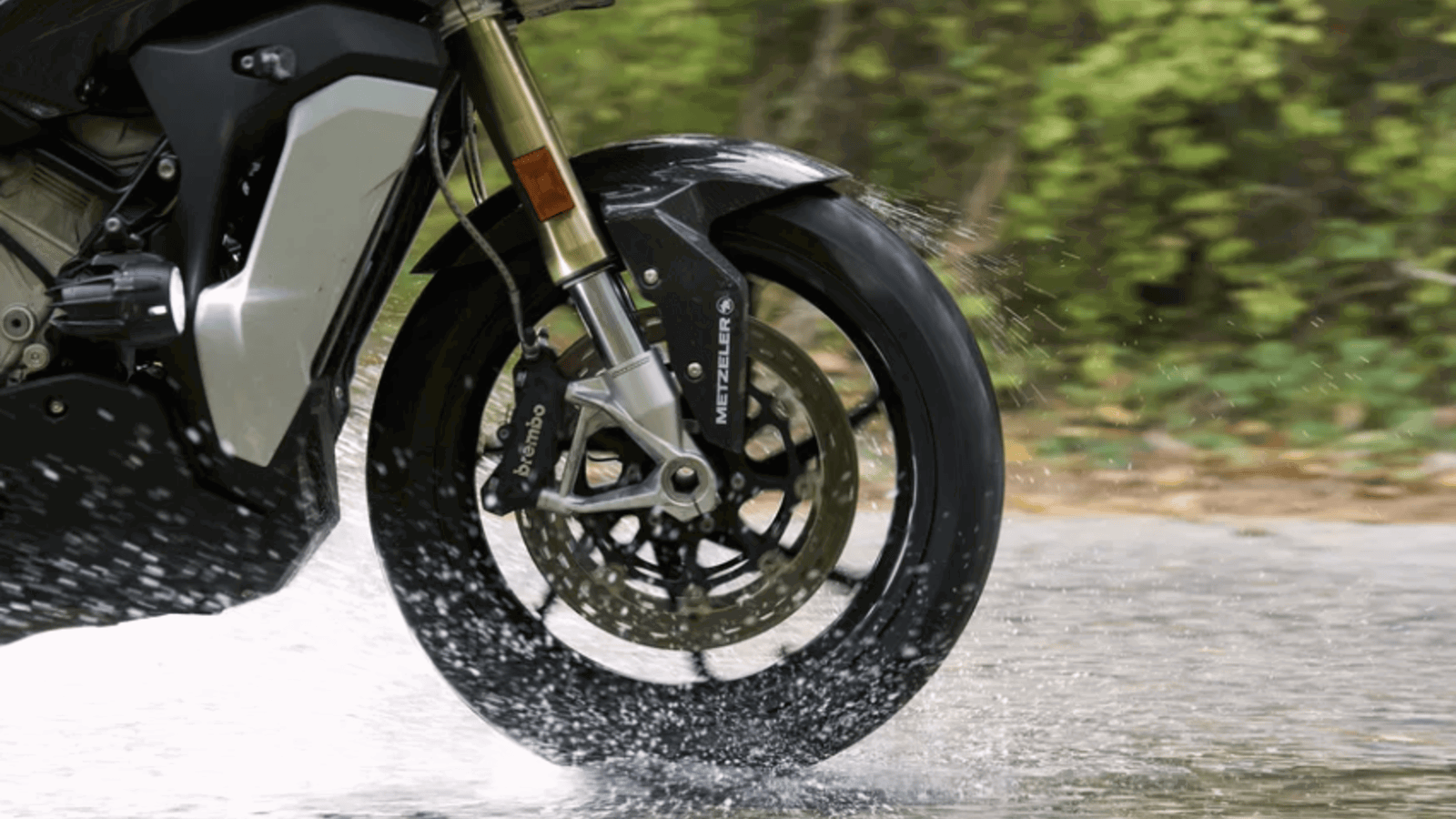 Metzeler tyre riding on a wet road