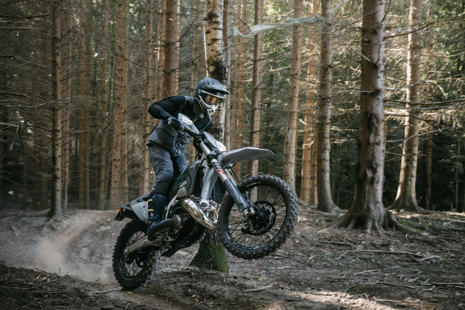 Husqvarna TE 300 Pro being ridden through the woods