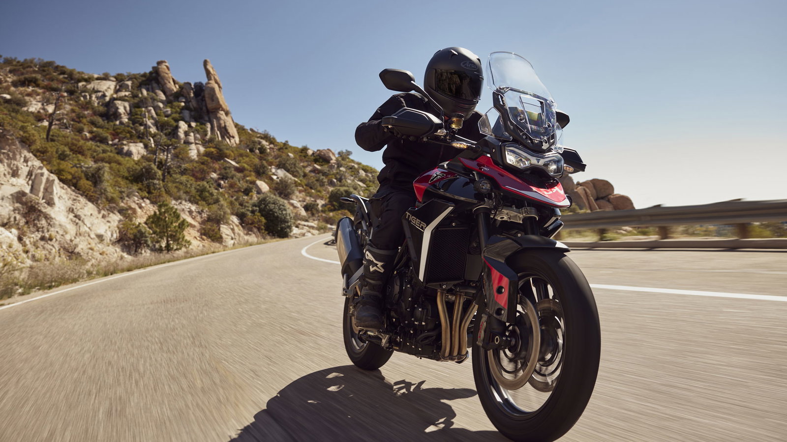 Triumph Tiger 900 GT Pro riding on the road