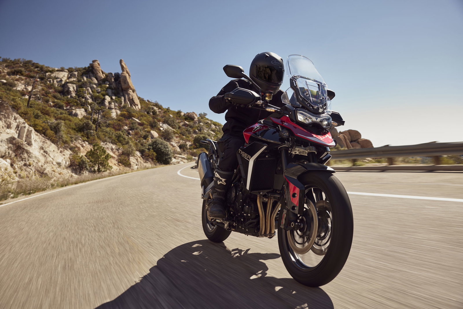 Triumph Tiger 900 GT Pro riding on the road