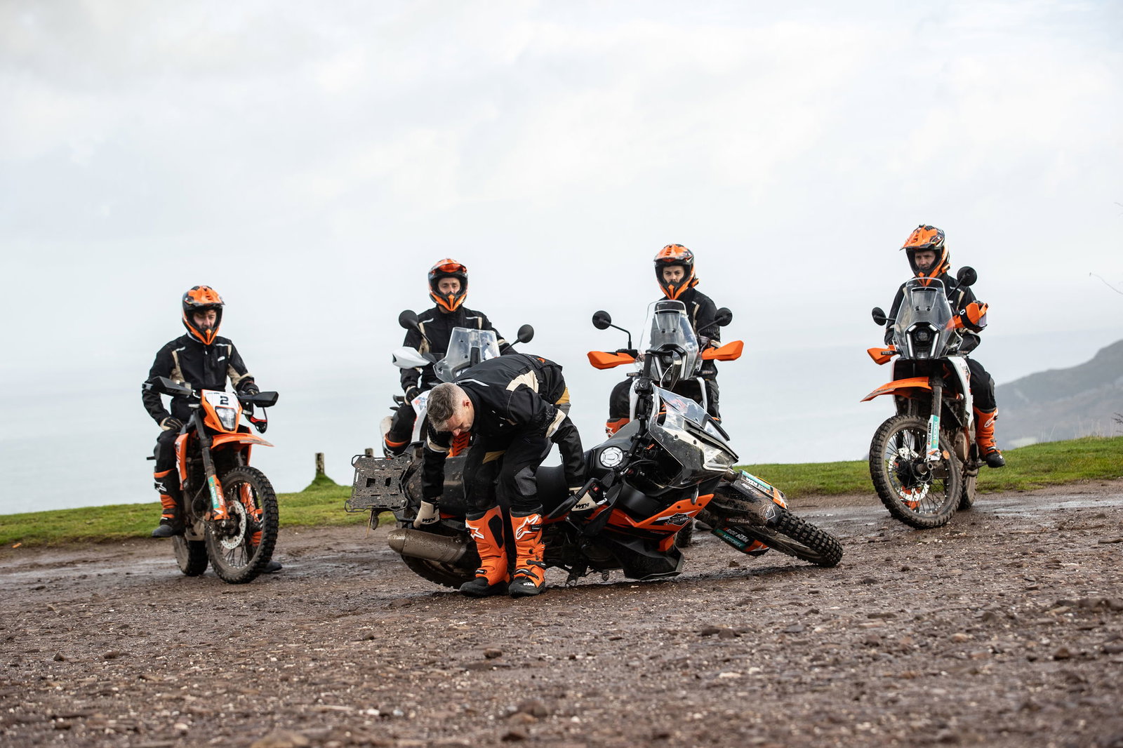 Alex Snow demonstrating how to pick up a KTM motorcycle from the ground