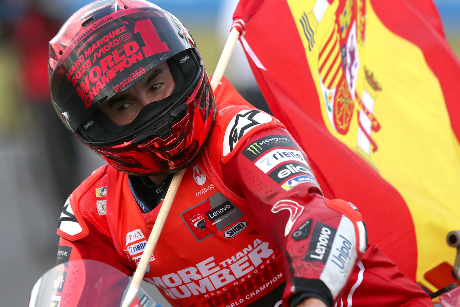 Marc Marquez riding with the helmet after winning his seventh MotoGP title