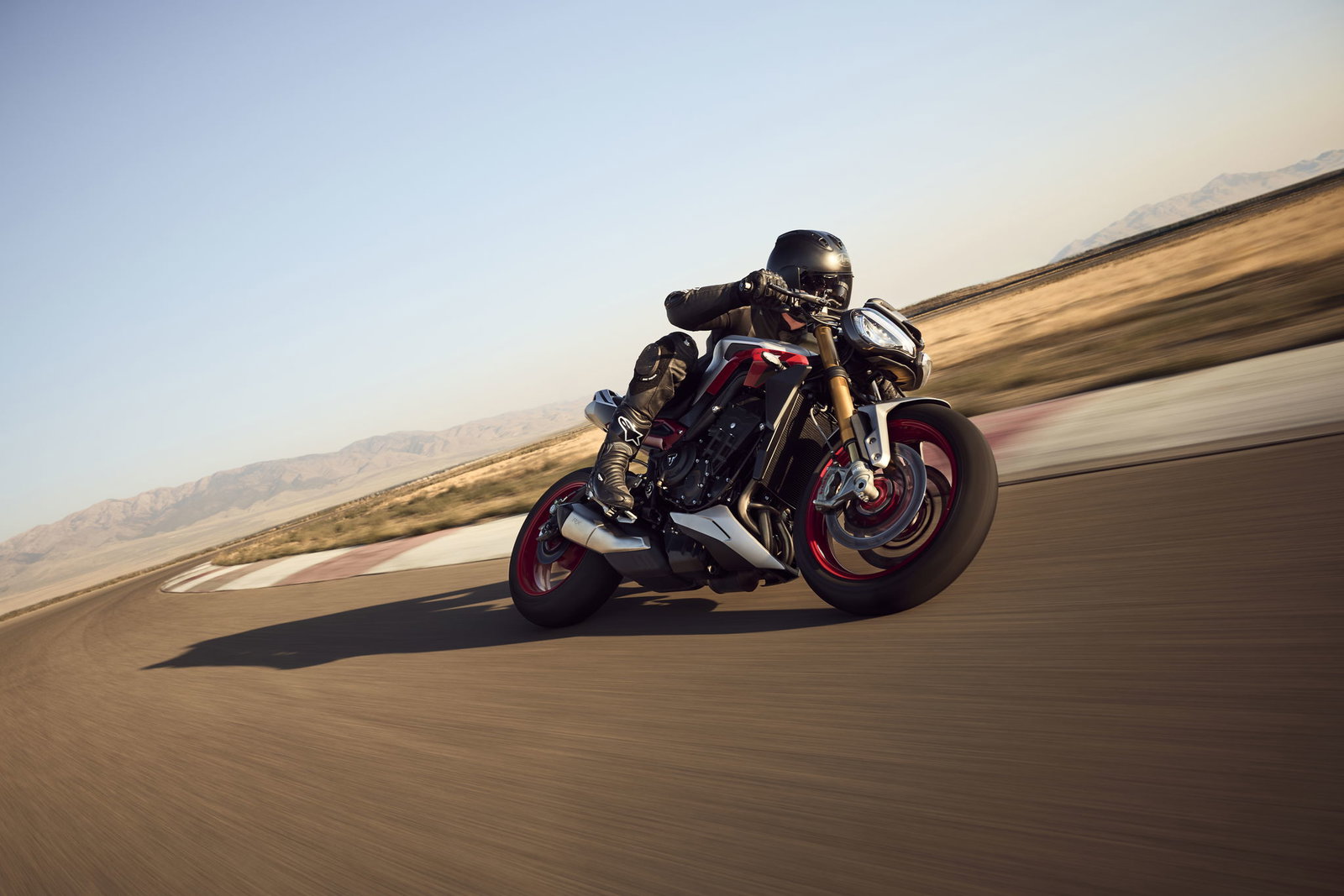 Triumph Street Triple 765 RX being ridden on a track