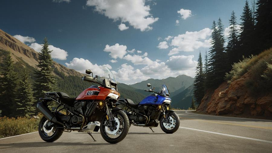 Two Harley Pan America bikes parked on the road
