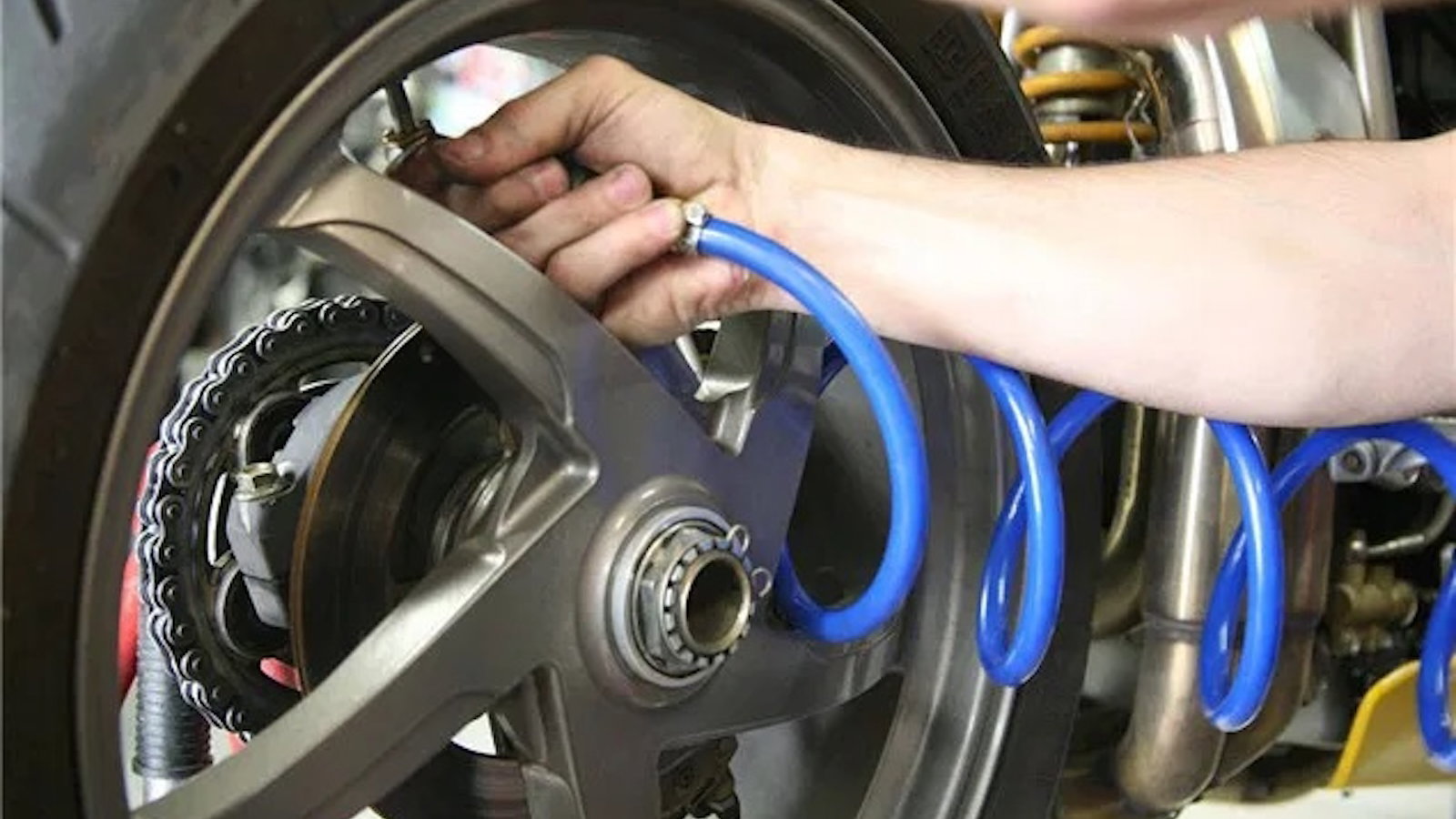 Pumping up the tyre of a Ducati 916