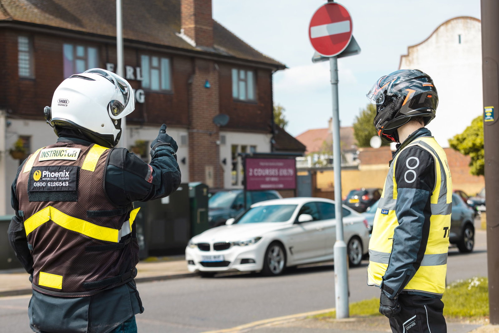 Motorcycle instructor teaching a learner rider
