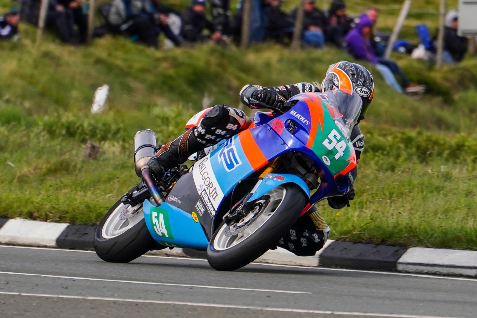 Maria Costello riding a motorcycle at the TT. Photo credit - Iconic Auctioneers