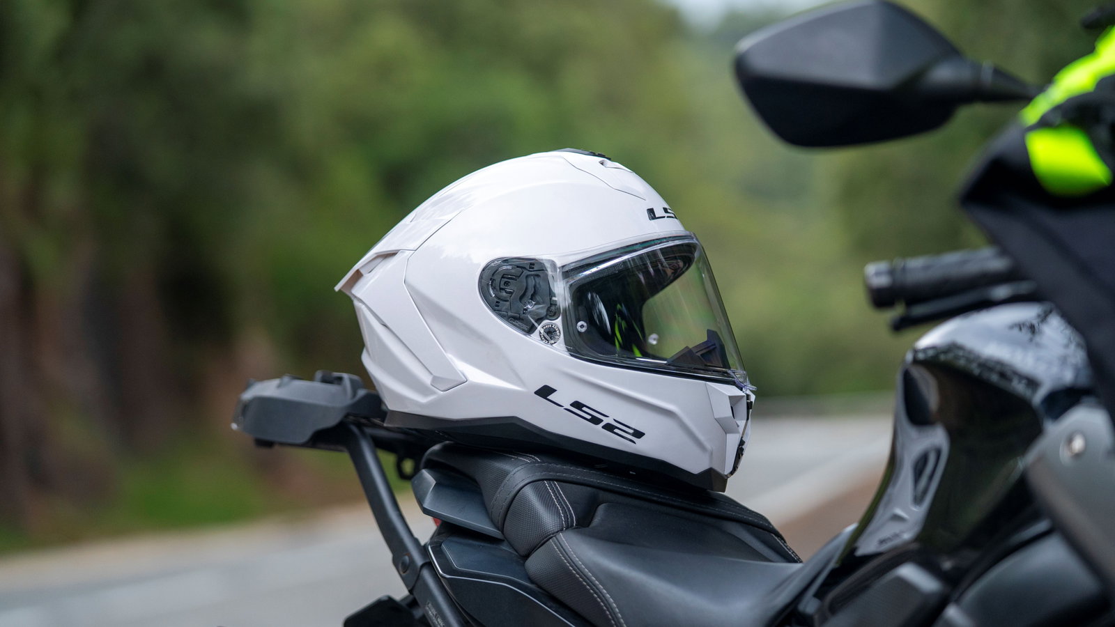 LS2 Challenger II helmet resting on a motorcycle