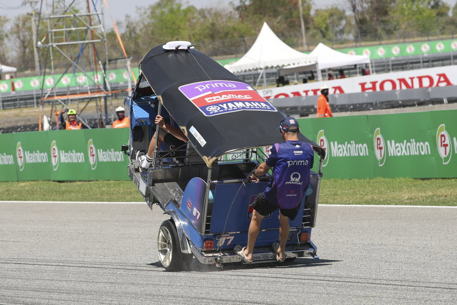 Toprak Razgatlioglu and Jack Miller racing a Tuk Tuk. Photo credit - Gold and Goose