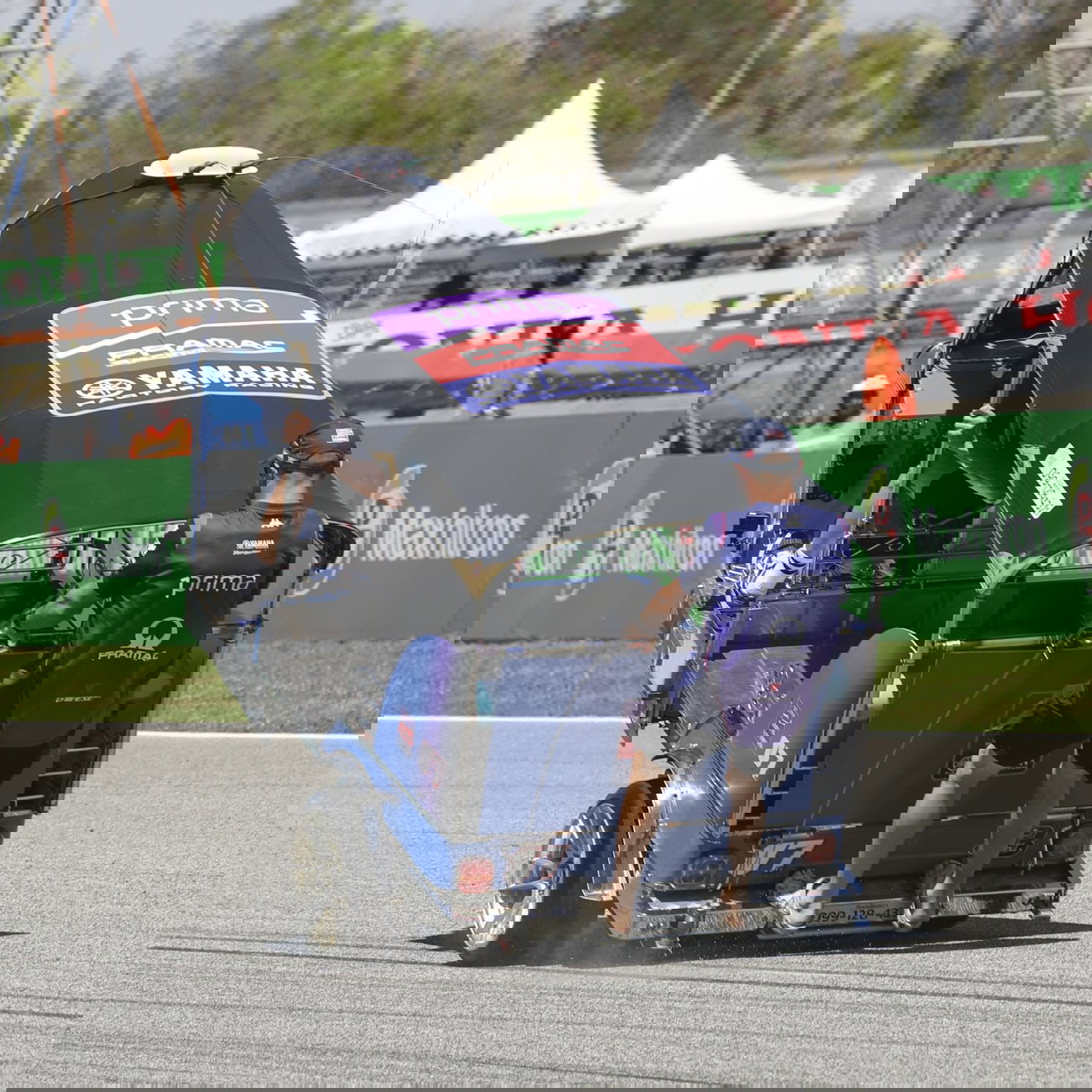 Toprak Razgatlioglu and Jack Miller racing a Tuk Tuk. Photo credit - Gold and Goose