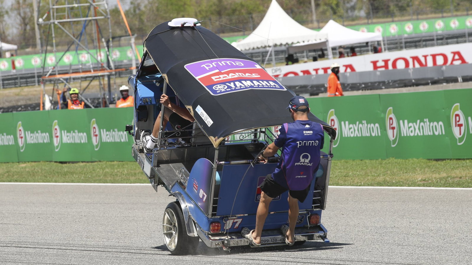 Toprak Razgatlioglu and Jack Miller racing a Tuk Tuk. Photo credit - Gold and Goose