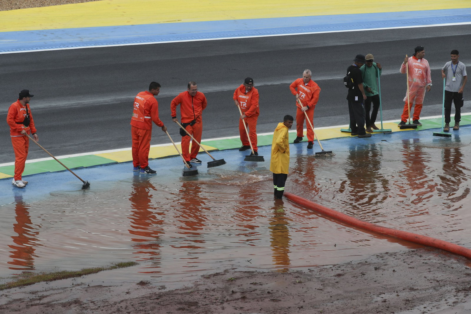 Marshals clearing water from the Goiania track. Photo credit - Gold and Goose
