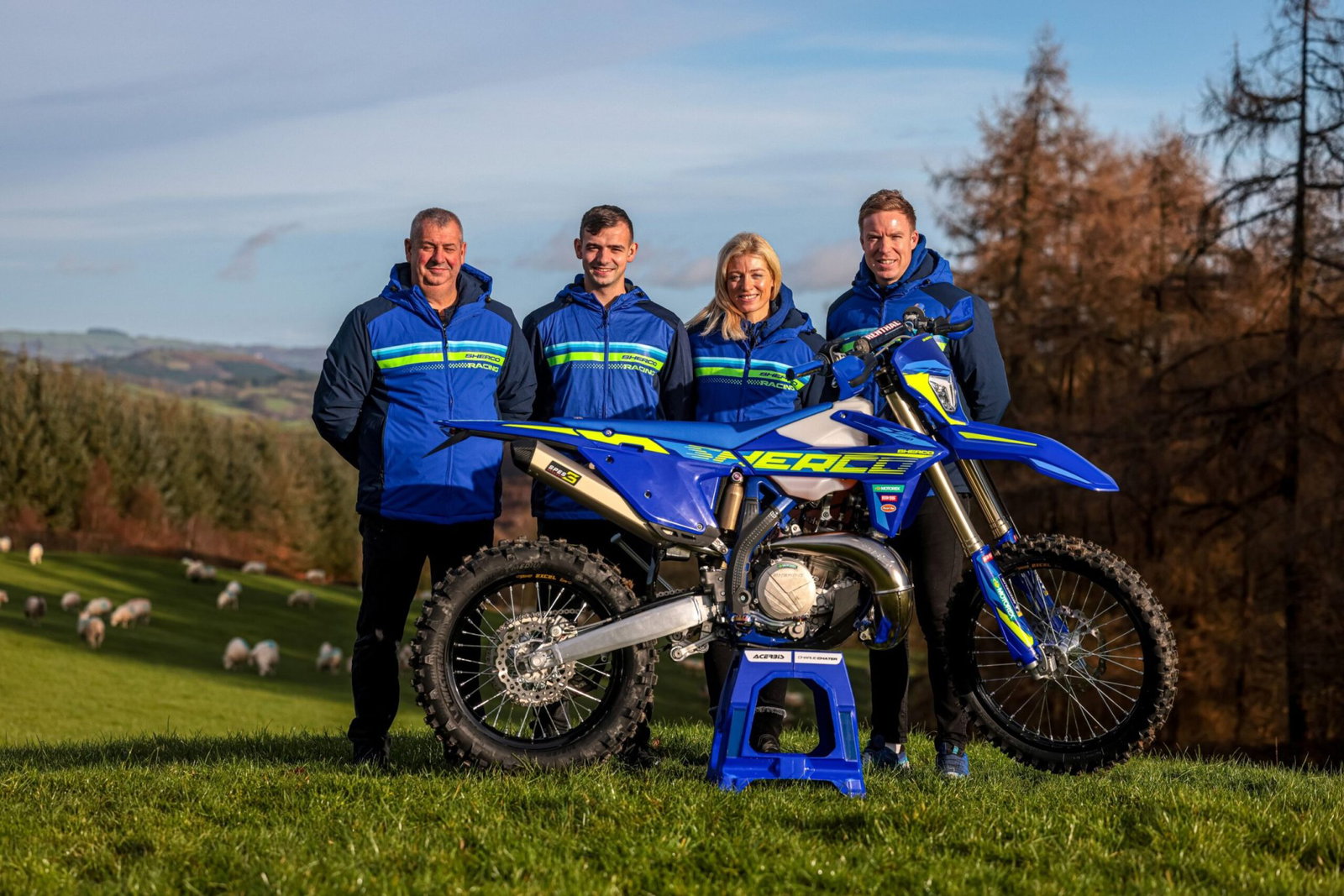 Sherco members of staff and an enduro machine. Photo credit - Sherco