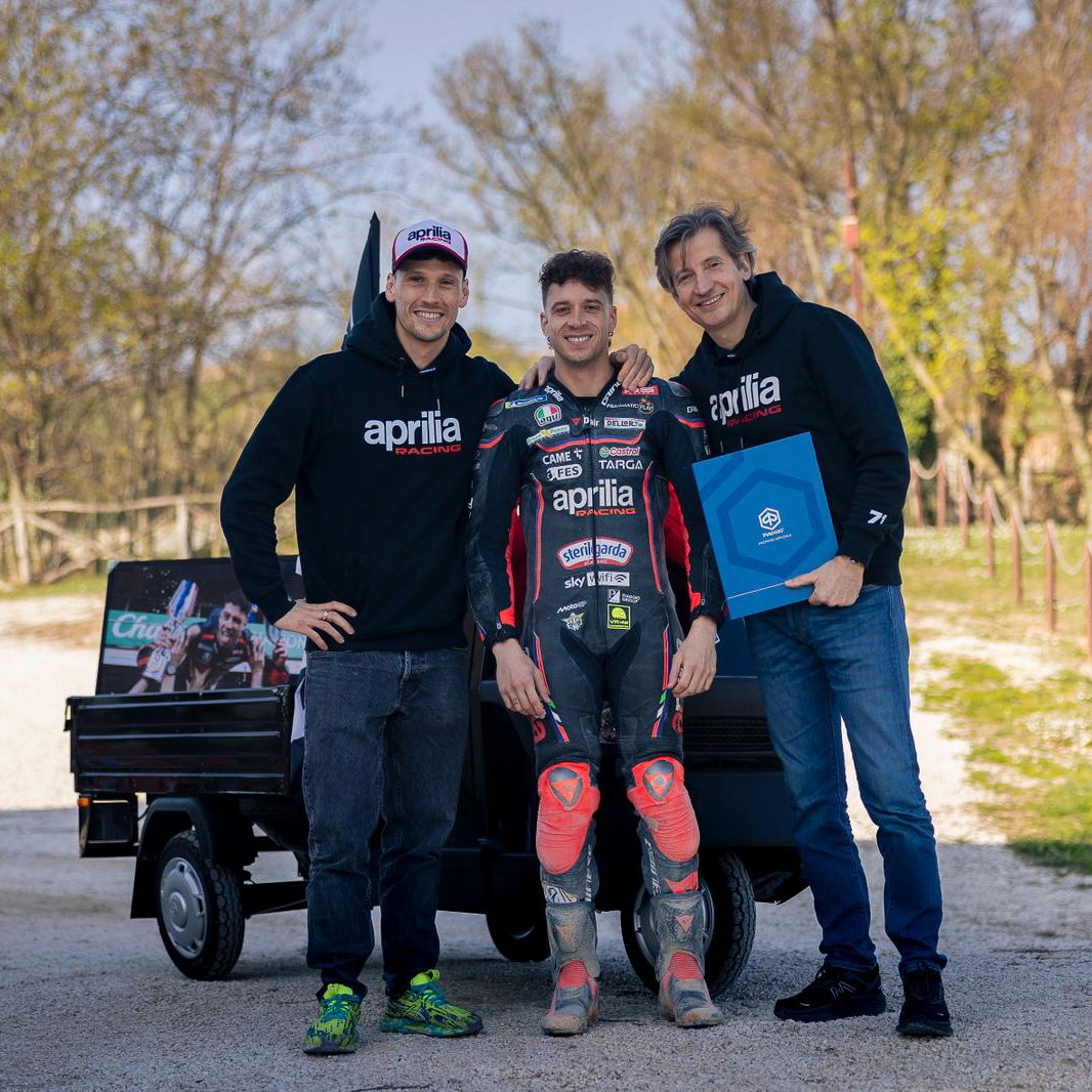 Lorenzo Savadori, Marco Bezzecchi, Massimo Rivola with Piaggio Ape. Credit: Aprilia Racing.