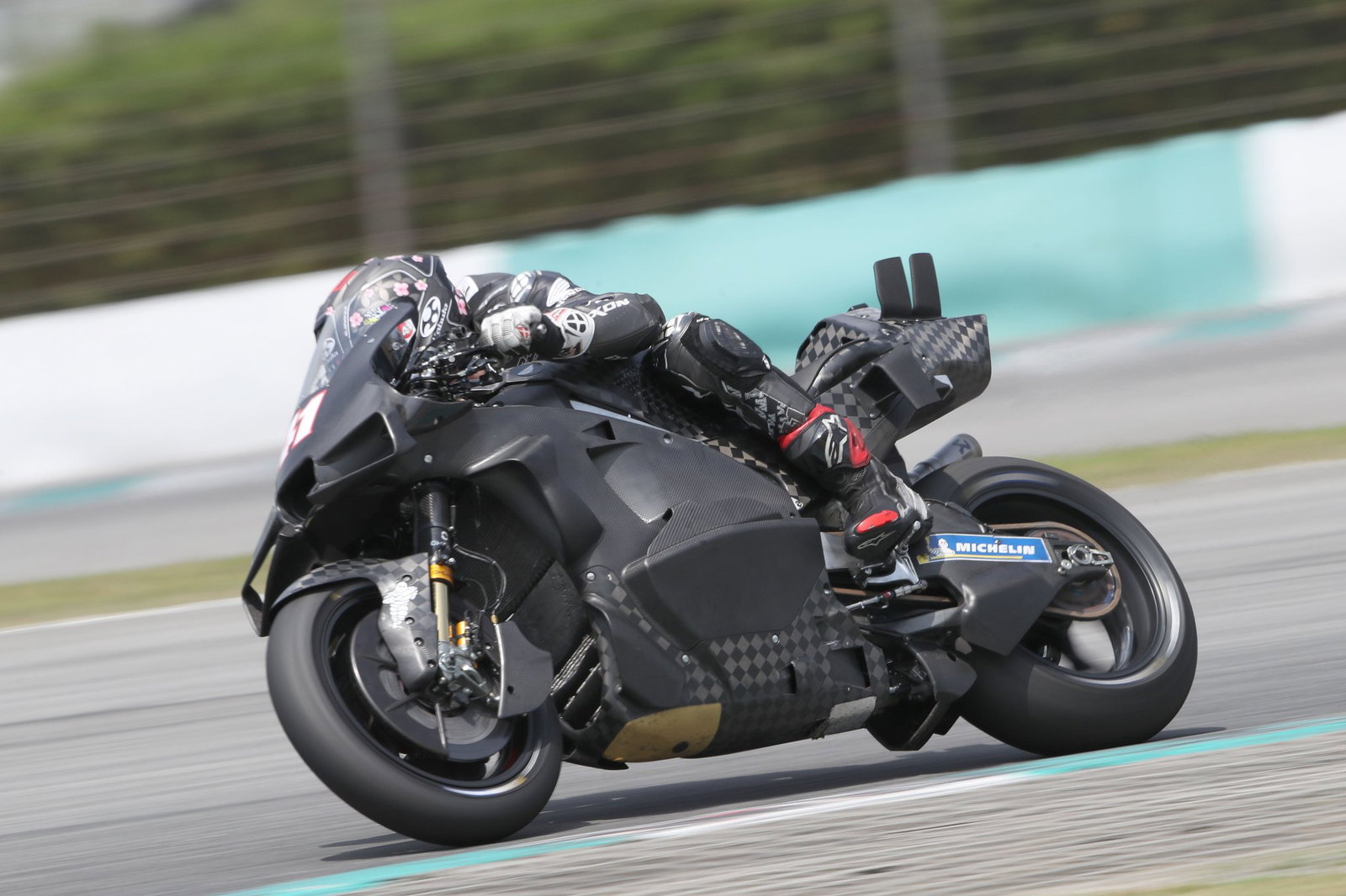 Aleix Espargaro riding a Honda MotoGP bike. Photo credit - Gold and Goose