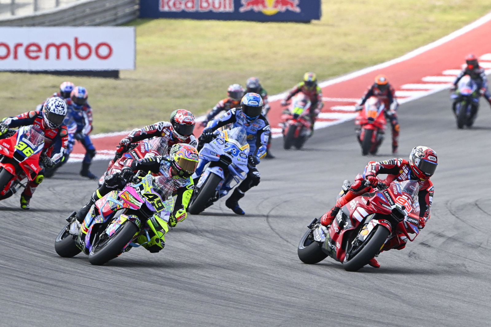 Marc Marquez making a pass on Fabio Di Giannantonio. Photo credit - Gold and Goose
