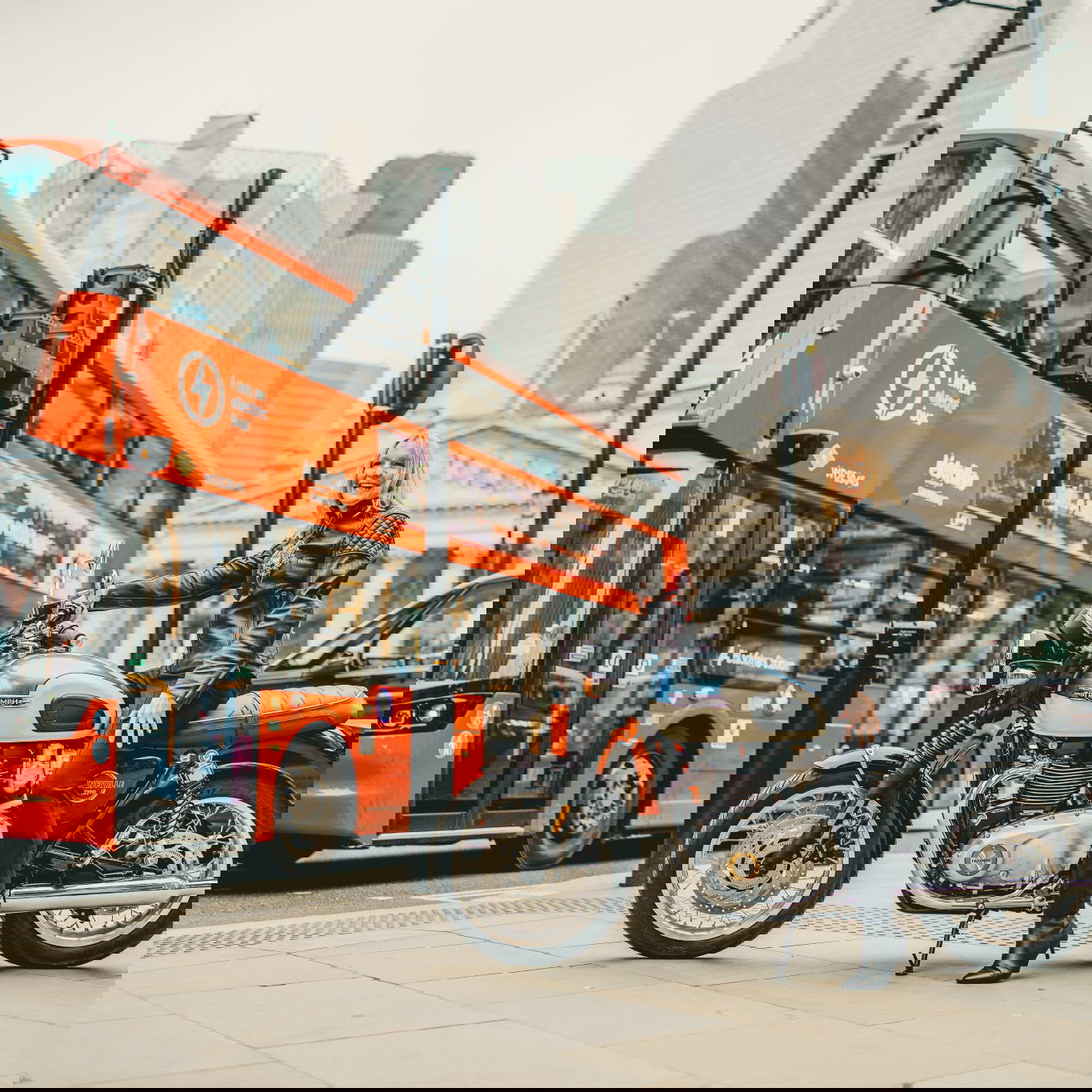 The Lady Mayor Dame Susan Langley with a Triumph motorcycle. 