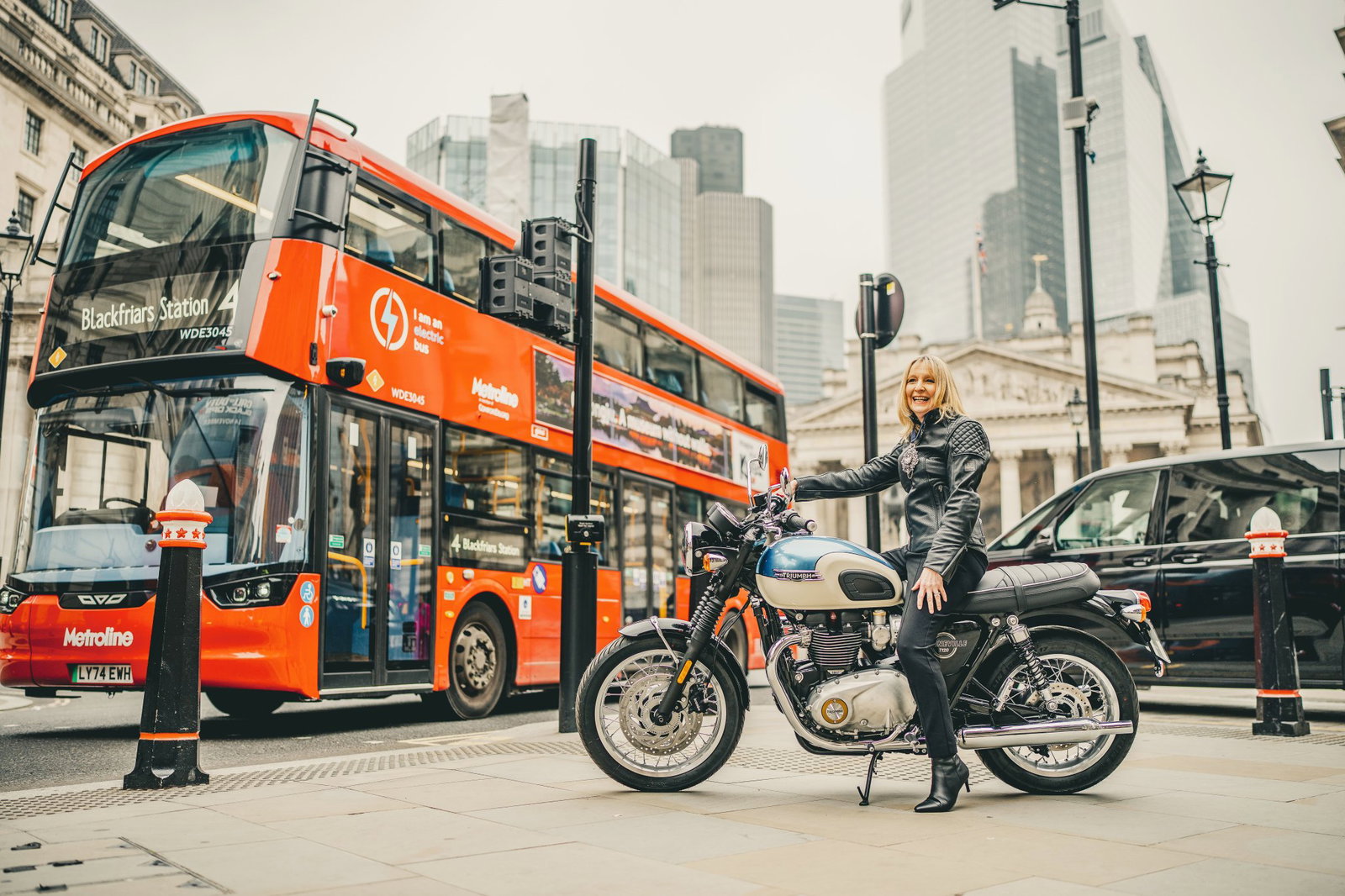 The Lady Mayor Dame Susan Langley with a Triumph motorcycle. 