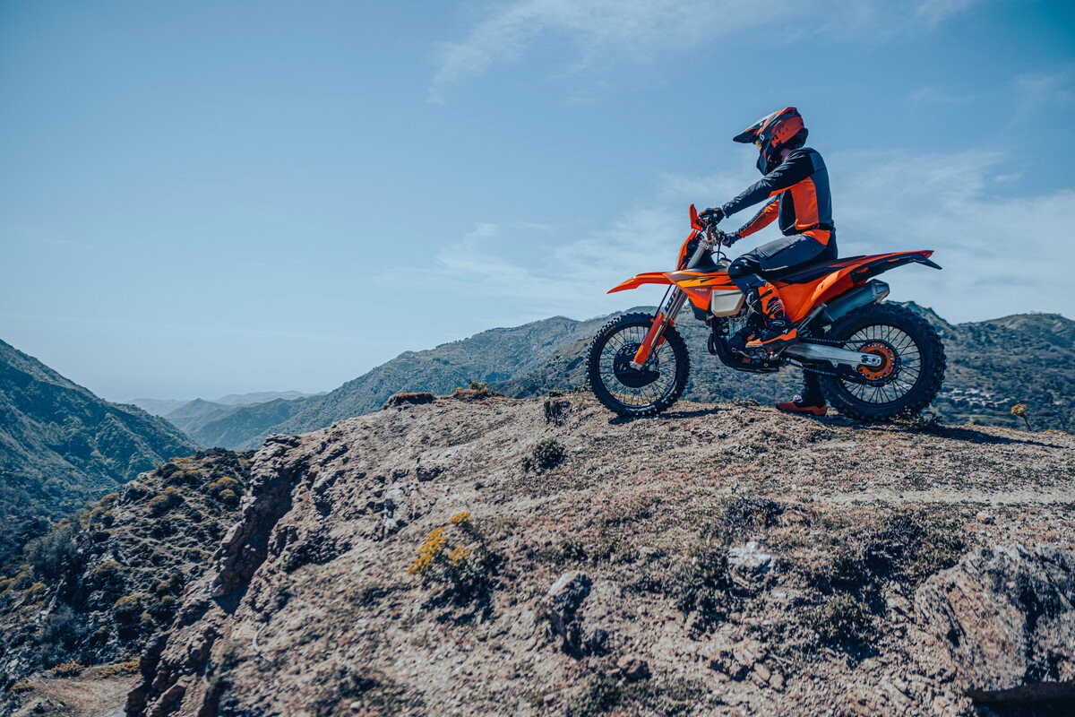 A KTM enduro bike at the top of a mountain.