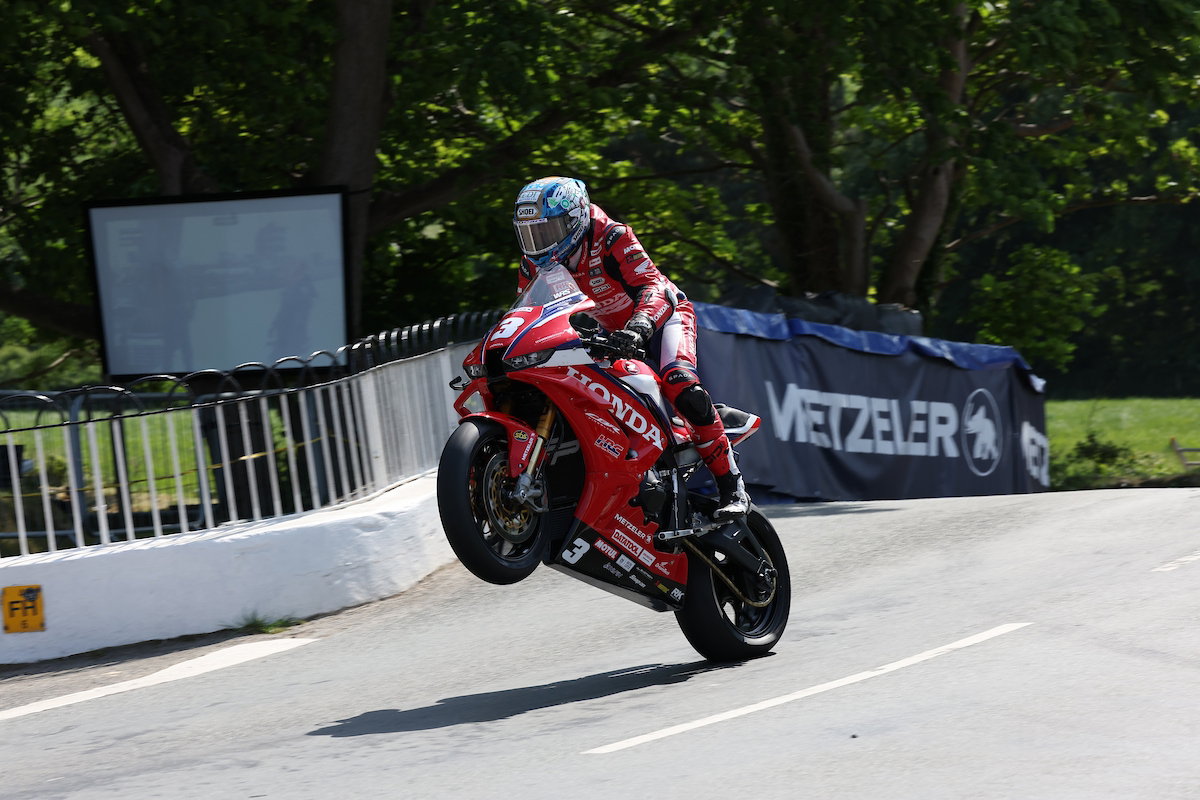 Dean Harrison with one tyre in the air at the 2026 TT.