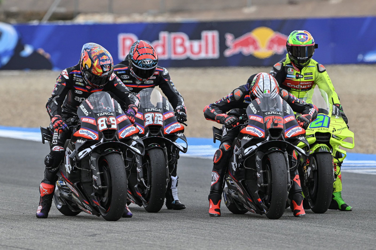 Aprilia test rider Lorenzo Savadori between Marco Bezzecchi and Jorge Martin.