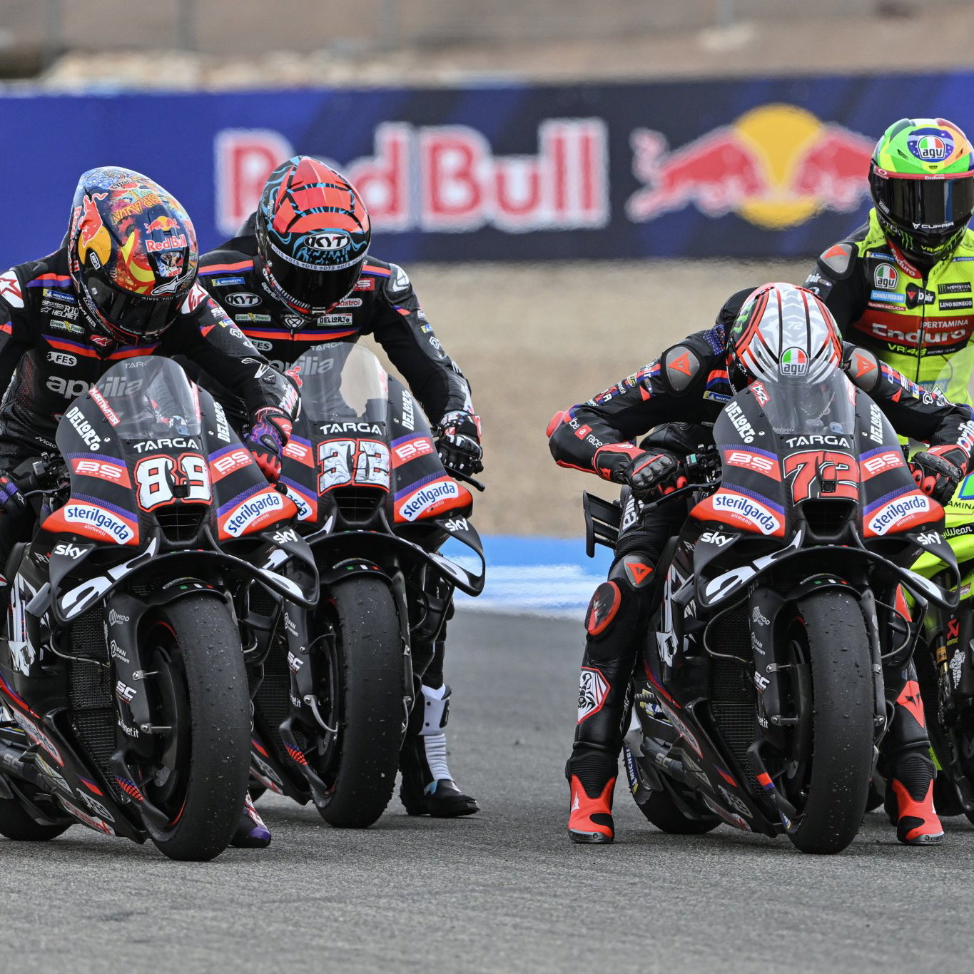 Aprilia test rider Lorenzo Savadori between Marco Bezzecchi and Jorge Martin.