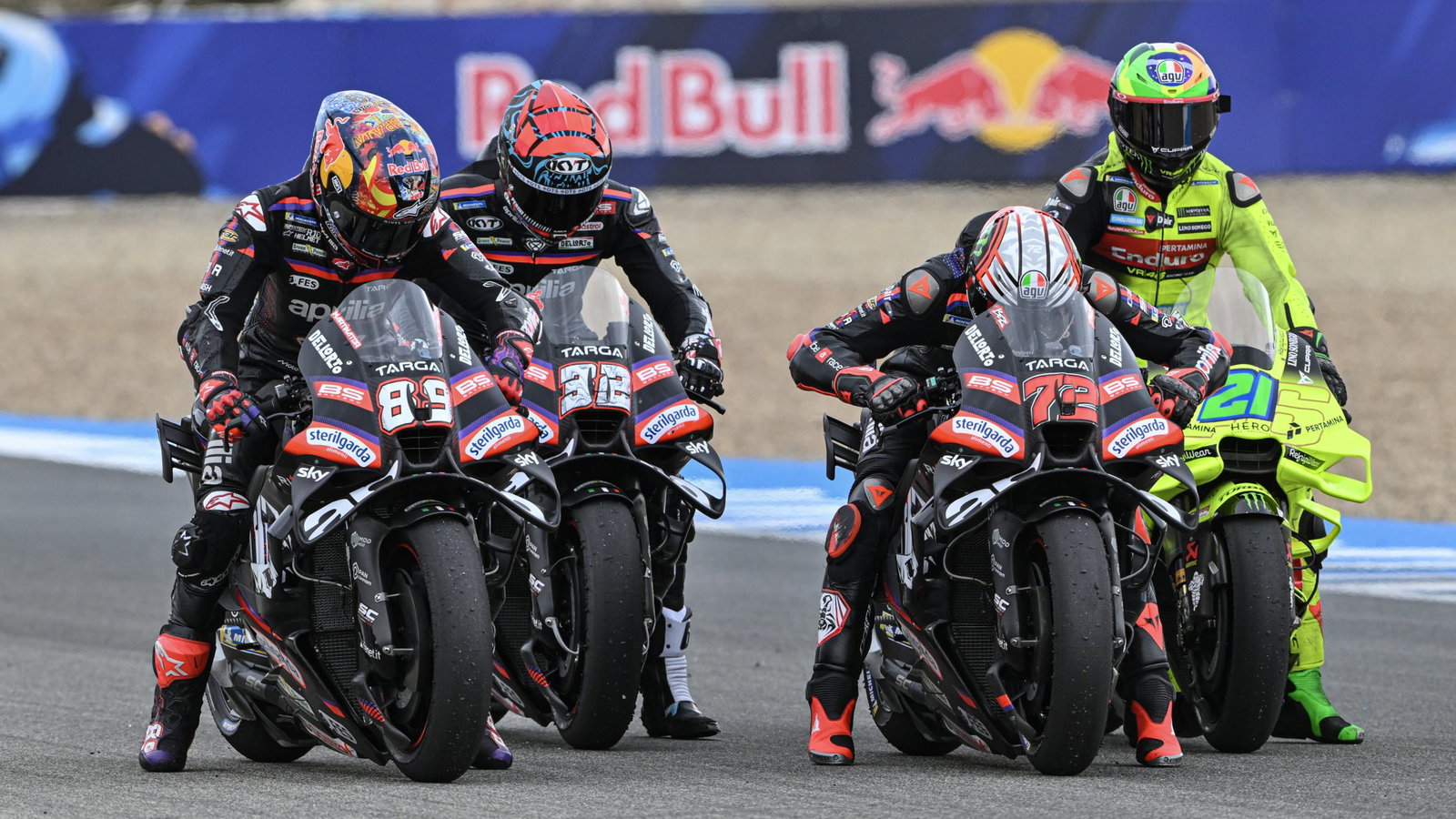 Aprilia test rider Lorenzo Savadori between Marco Bezzecchi and Jorge Martin.