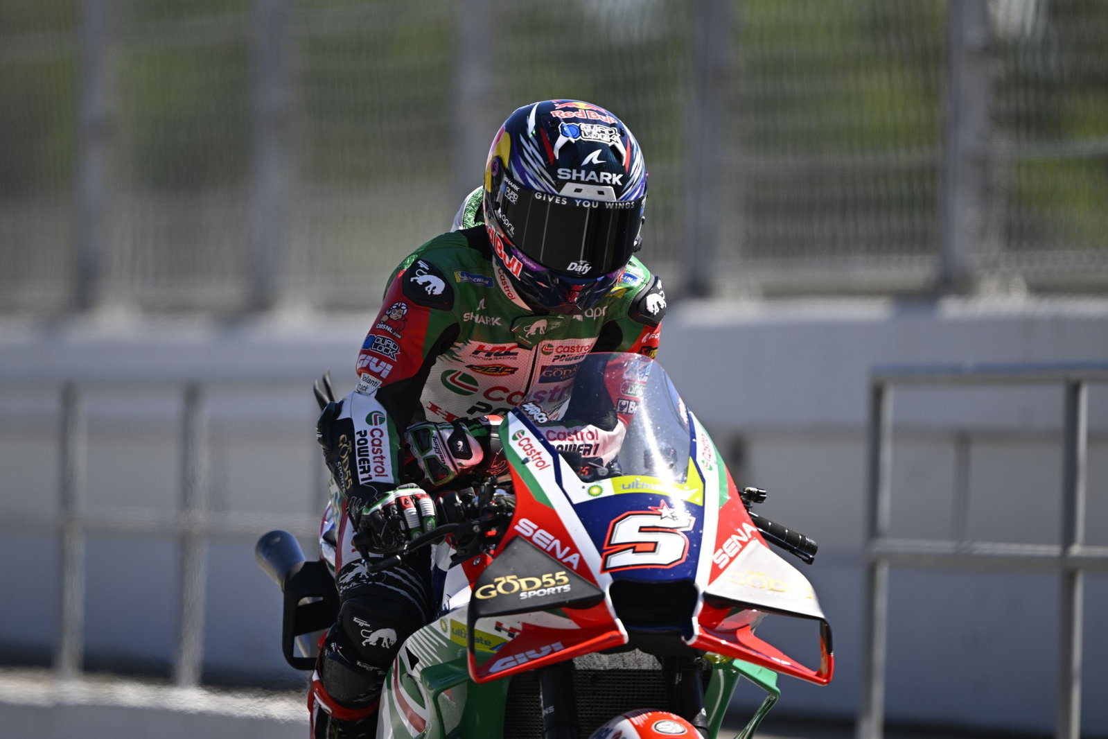 Johann Zarco riding through pit lane in Barcelona. Credit: Gold and Goose.