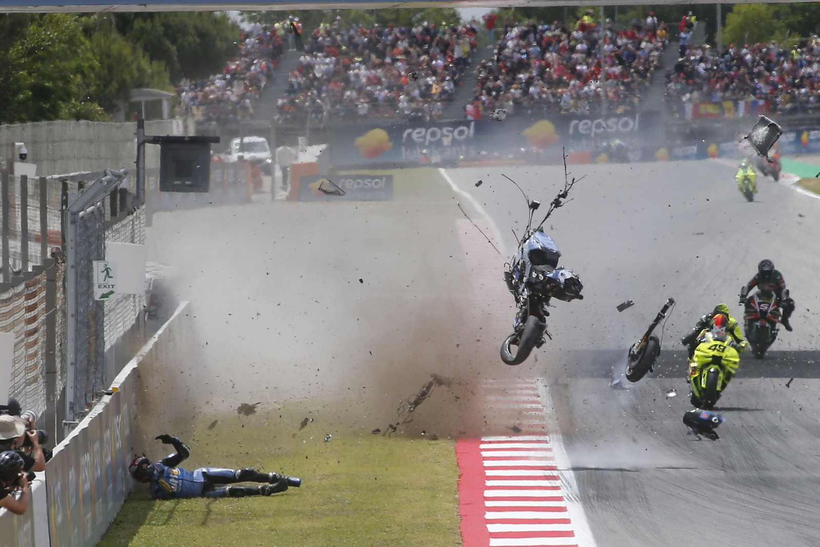 Alex Marquez crash with his bike flying through the air. Credit: Gold and Goose.